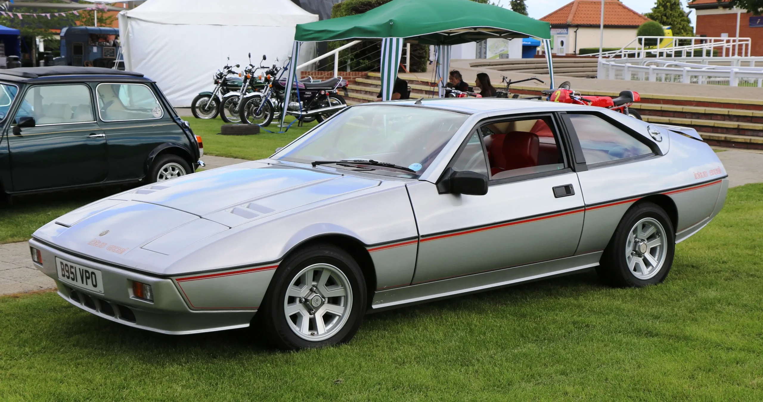 Sleek Lotus Excel sports car in motion, capturing speed and style