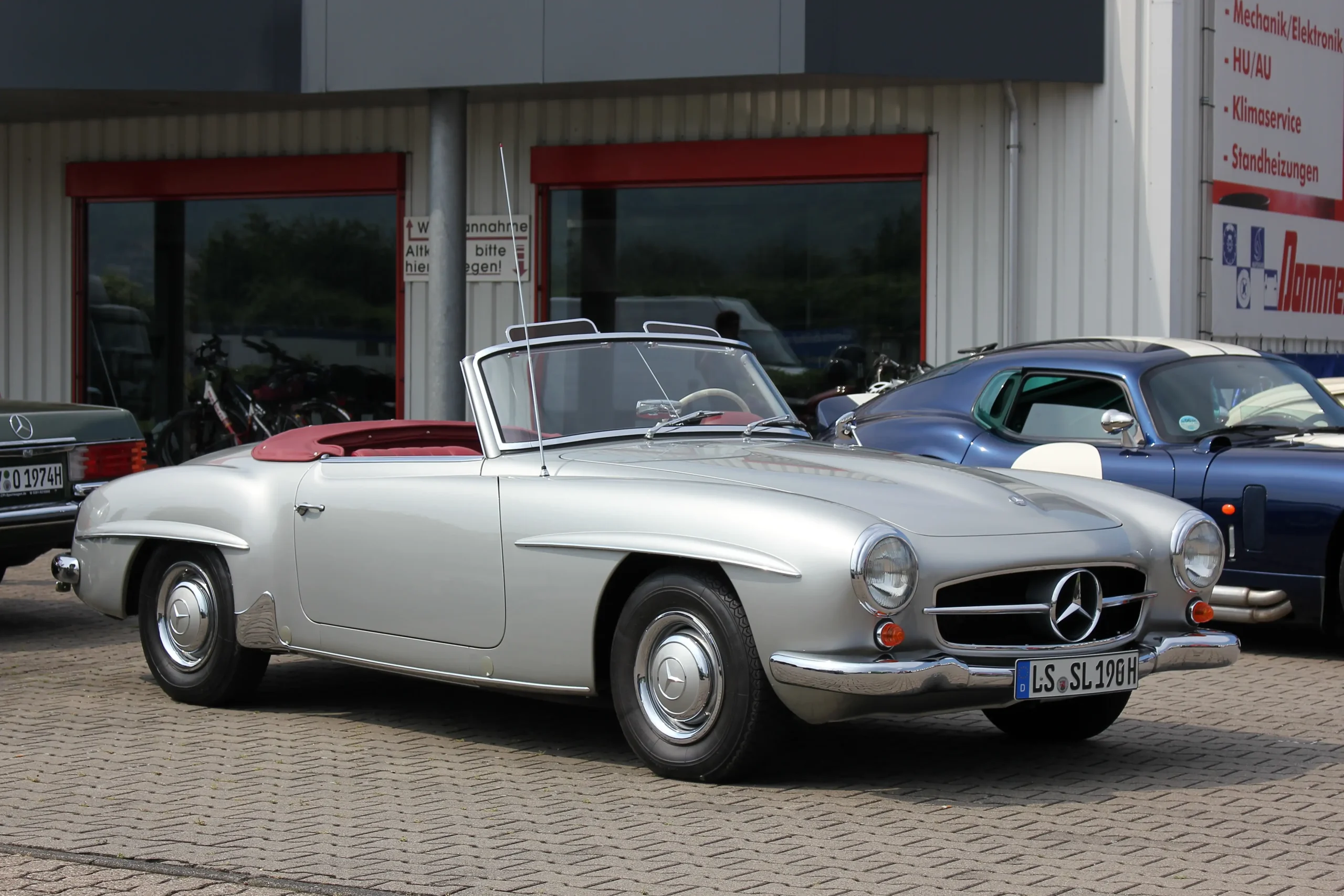 Classic Mercedes-Benz 190, sleek design, vintage car, silver color.