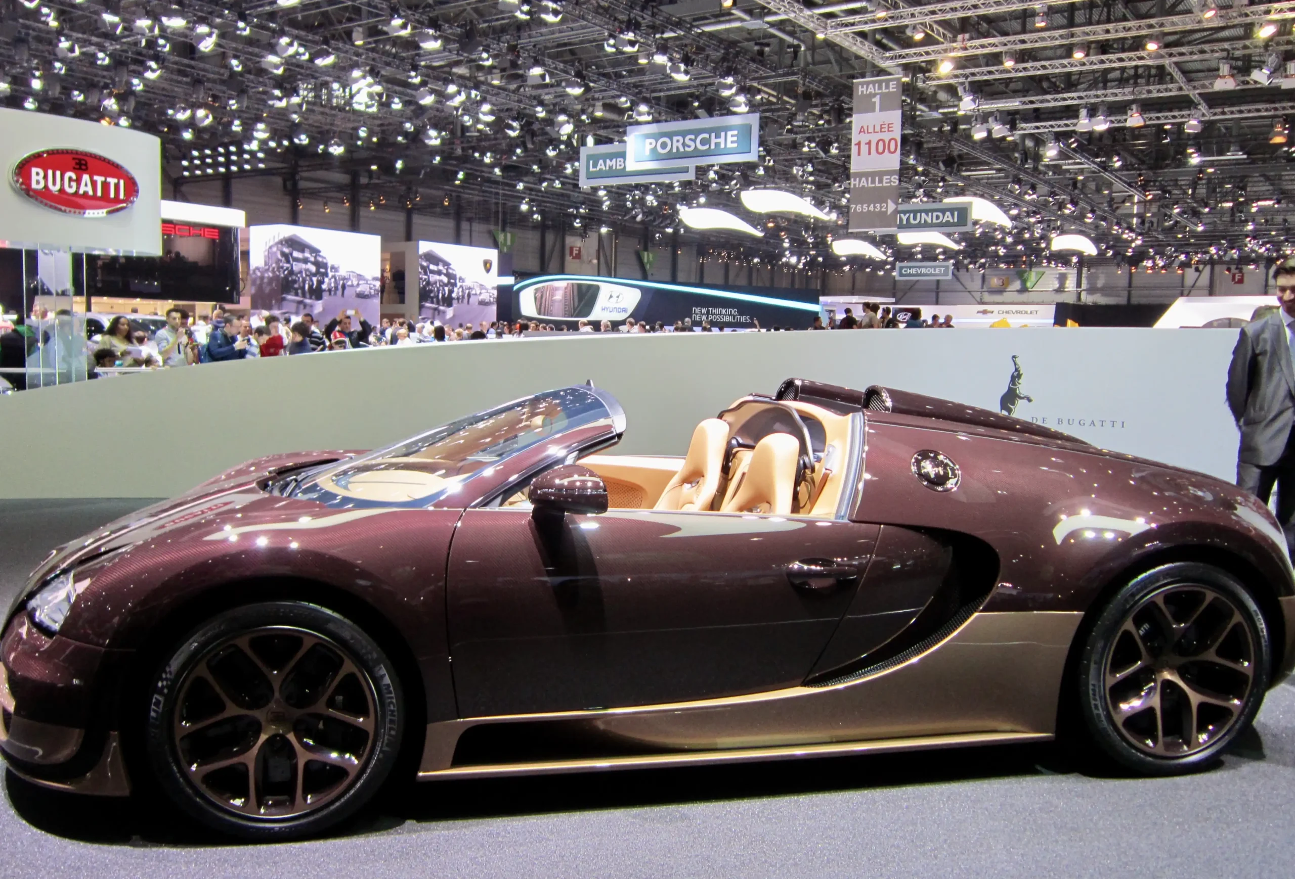 Luxurious Bugatti Veyron Grand Sport, sleek and powerful convertible supercar.