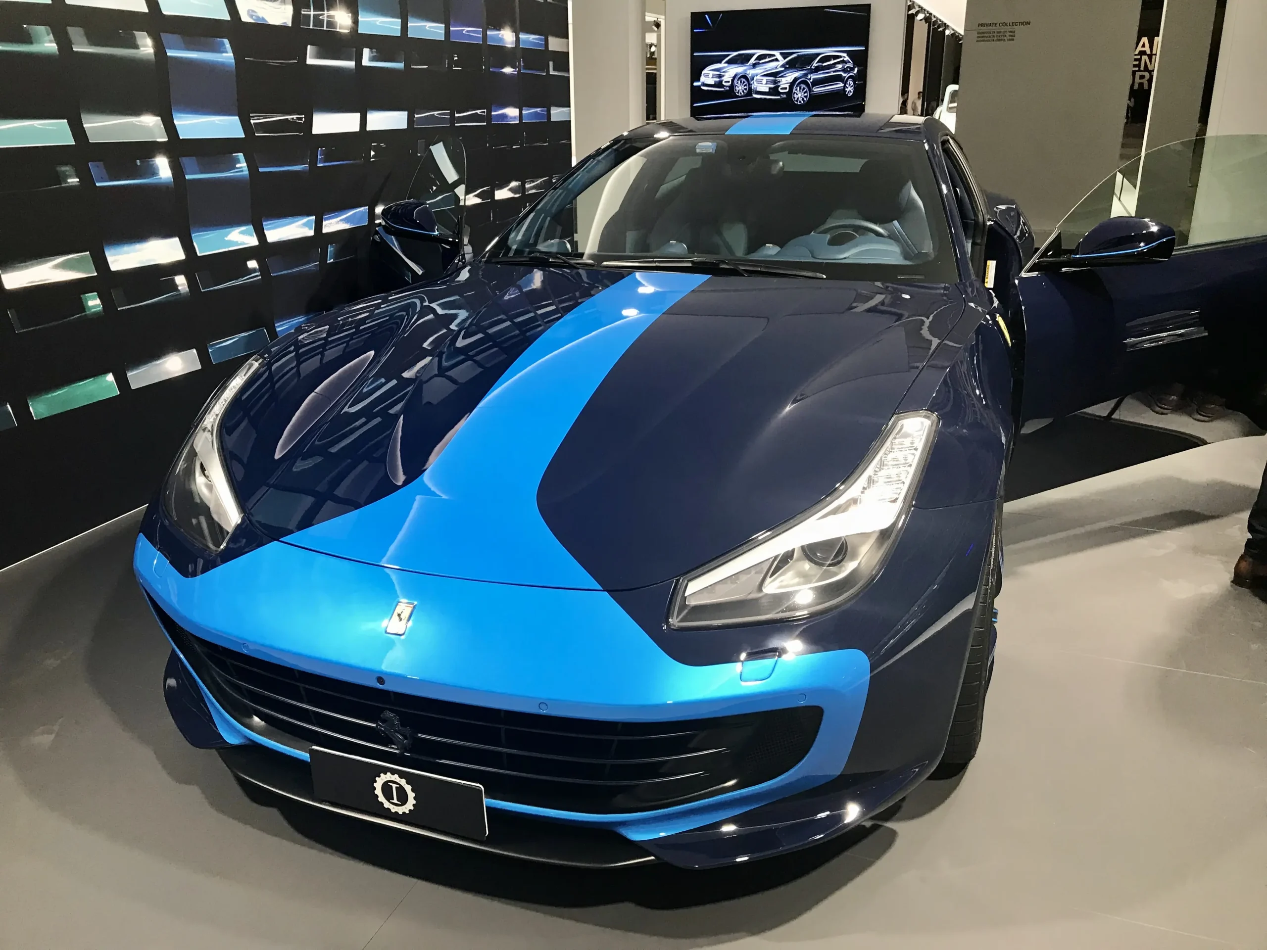 Sleek Ferrari GTC4Lusso in motion, showcasing its grand touring design.