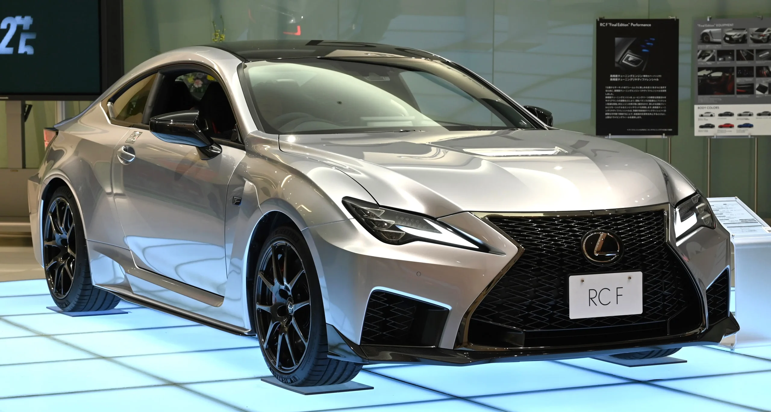 Sleek Lexus RC F sports car parked, showcasing its aggressive styling.