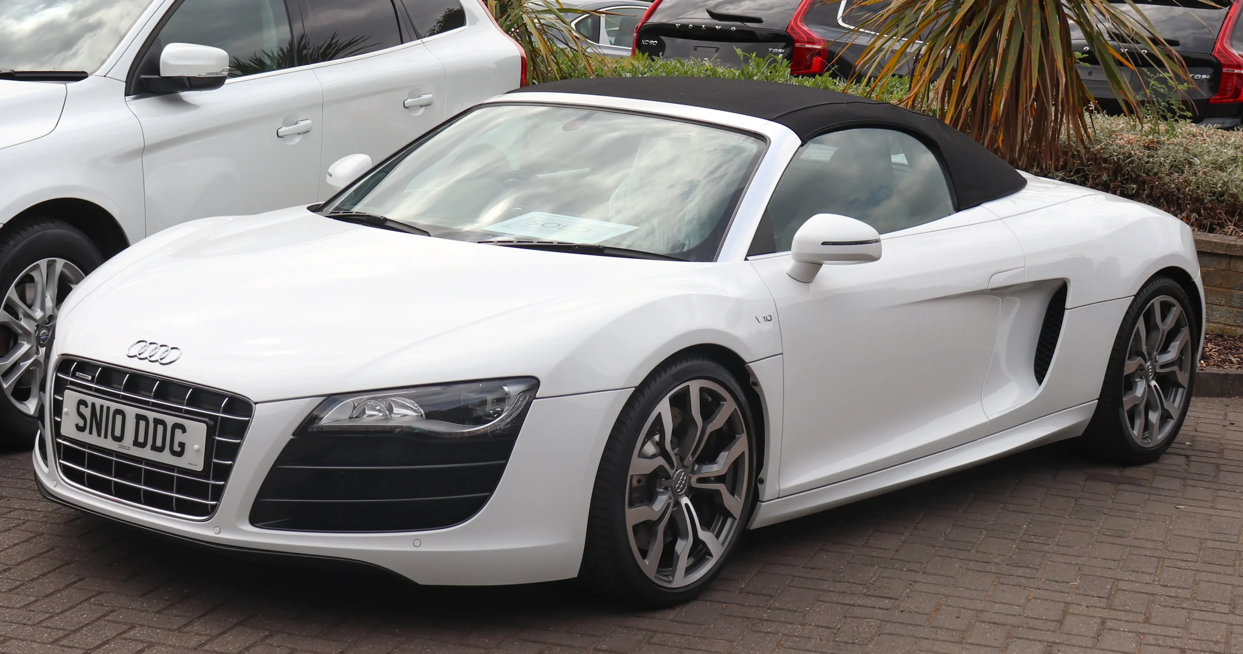 Sleek silver Audi R8, a powerful and luxurious sports car.