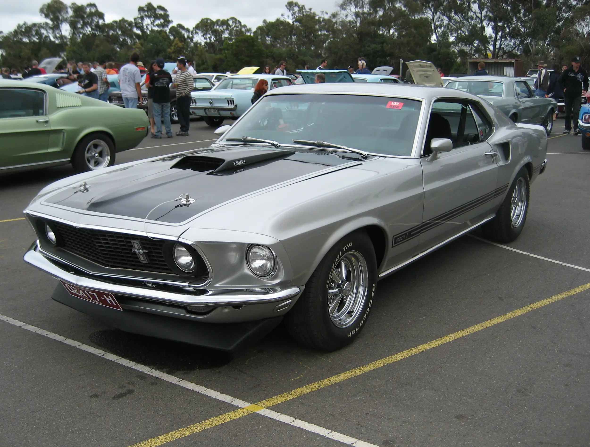 Fiery red 1969 Ford Mustang Mach 1, fastback beauty.