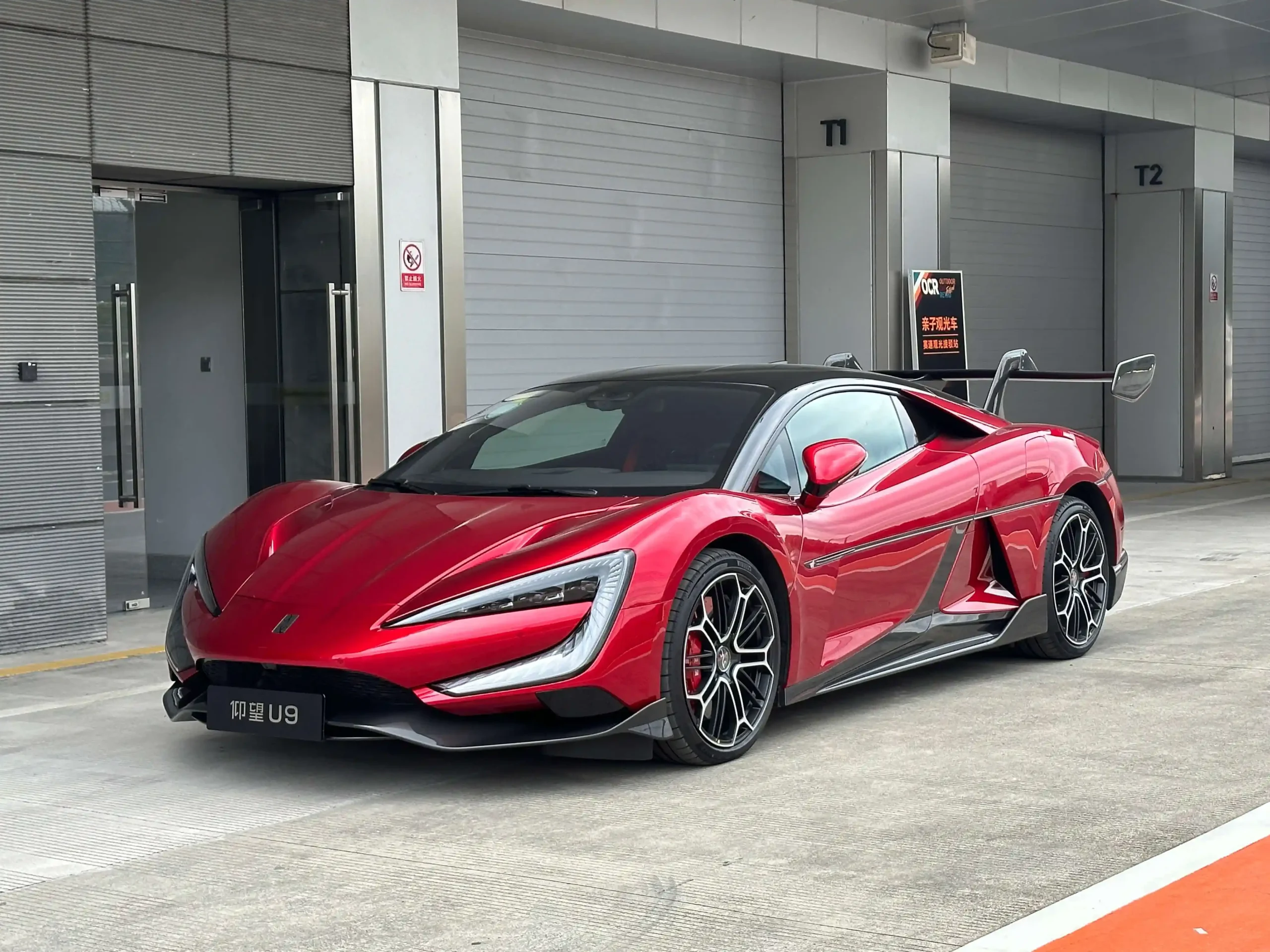 Sleek, futuristic Yangwang U9 electric supercar in striking red color