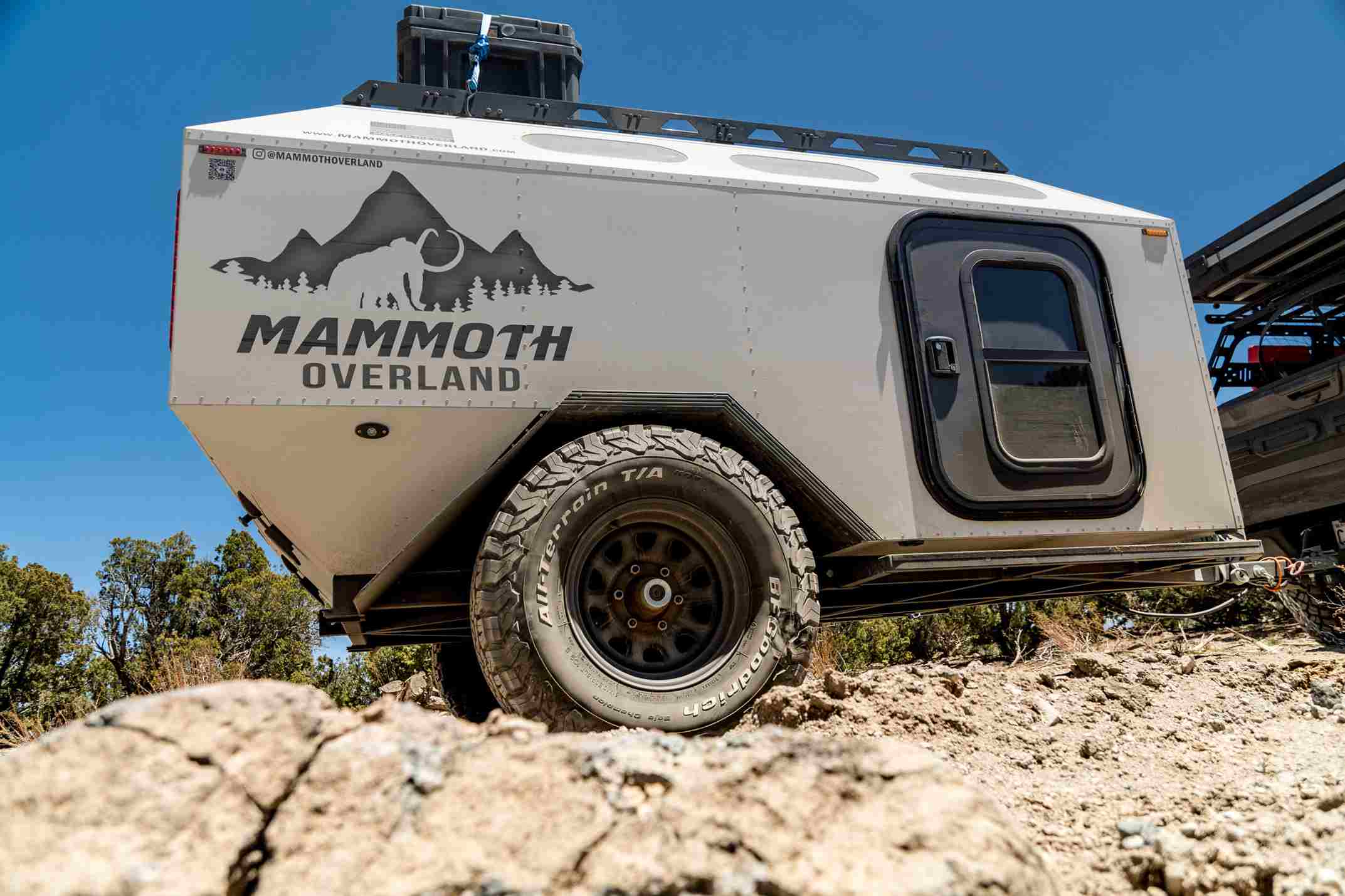  A rugged off-road trailer by Mammoth Overland with a reinforced aluminum body,