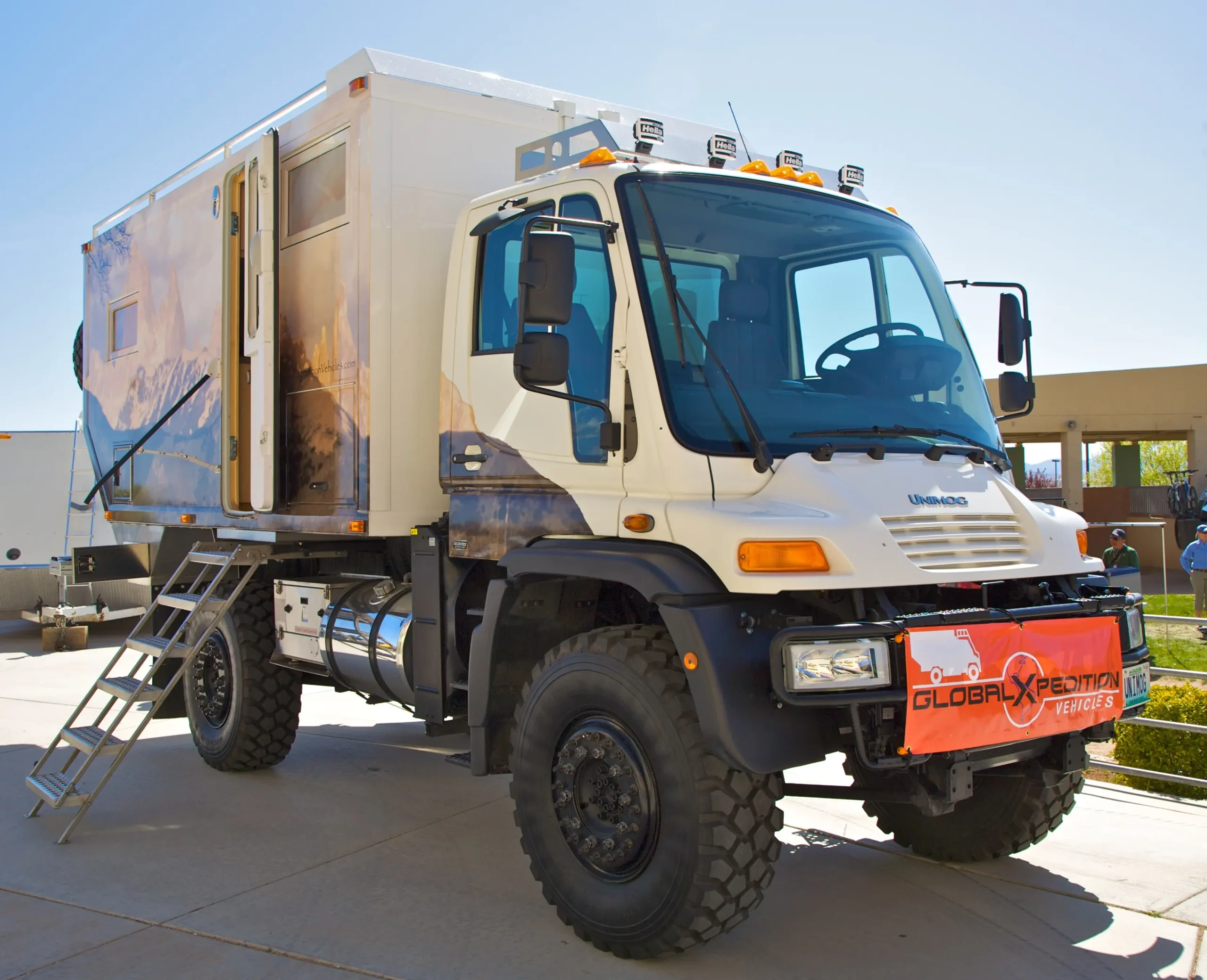 A bright orange Unimog U500 stands ready for off-road adventures.