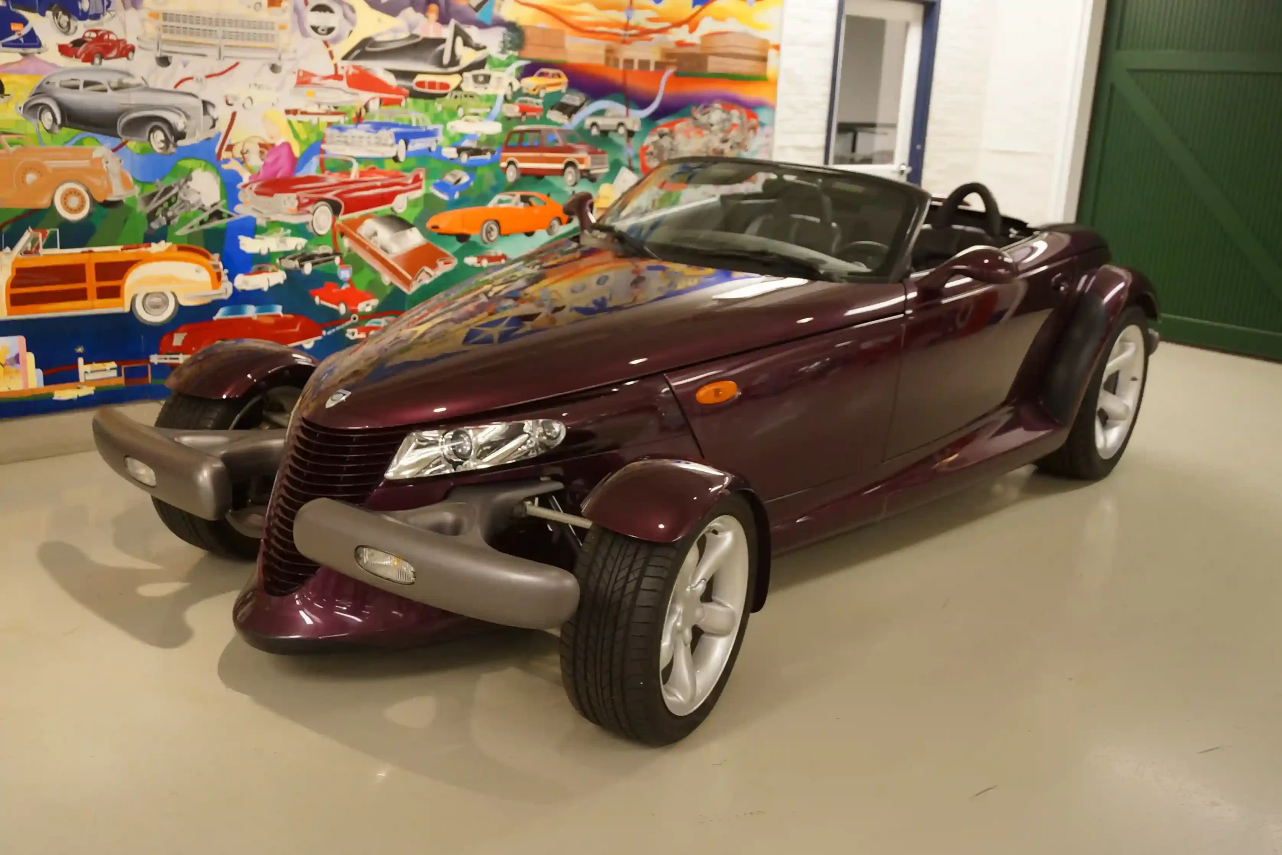 Retro-futuristic 1997 Plymouth Prowler, purple roadster, iconic design.