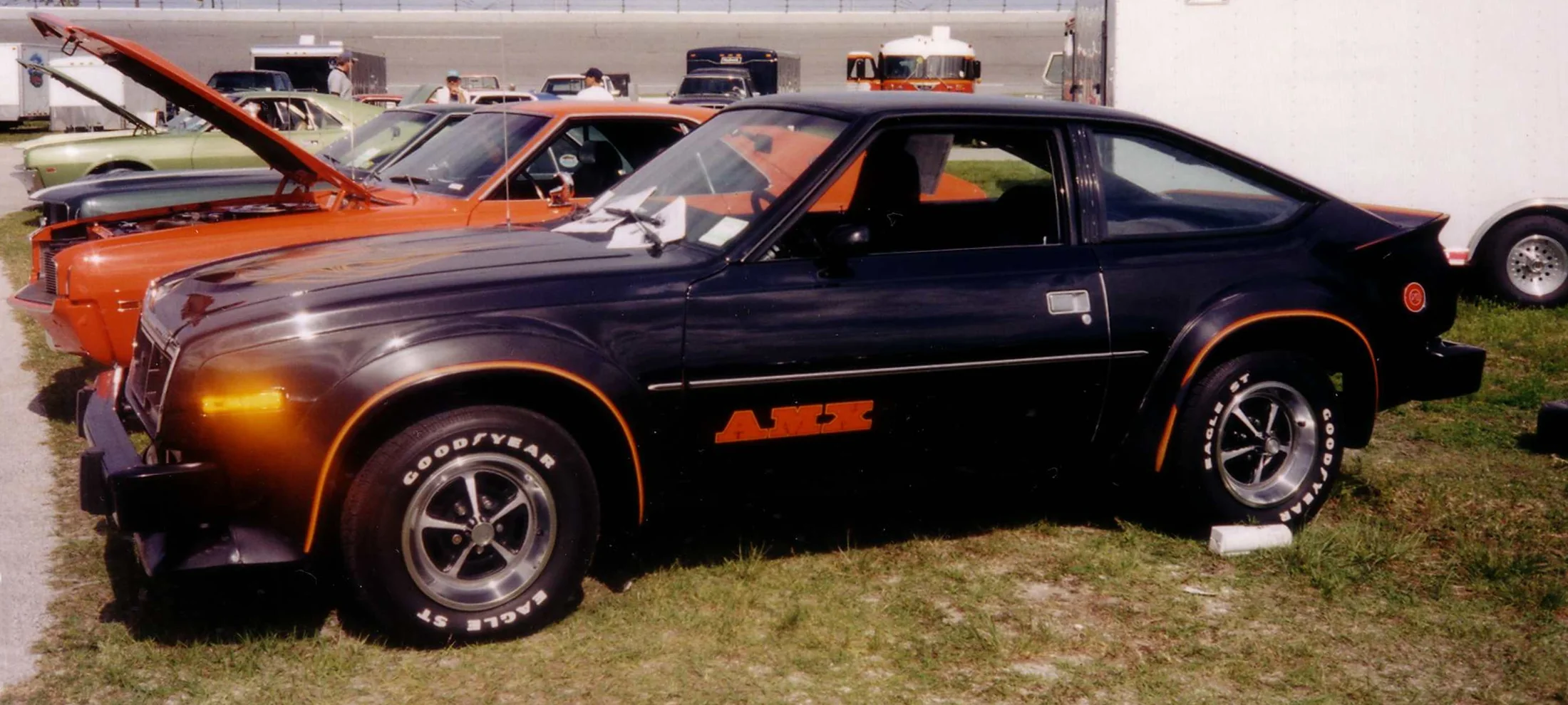 Sleek black 1980 AMC AMX, viewed from the left side.