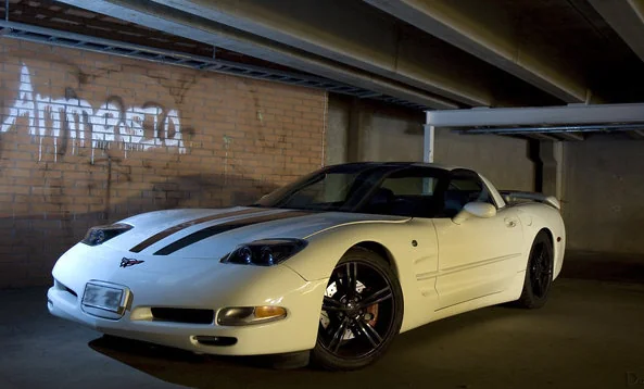Silver Chevrolet Corvette C5 parked, sleek design, classic American sports car.