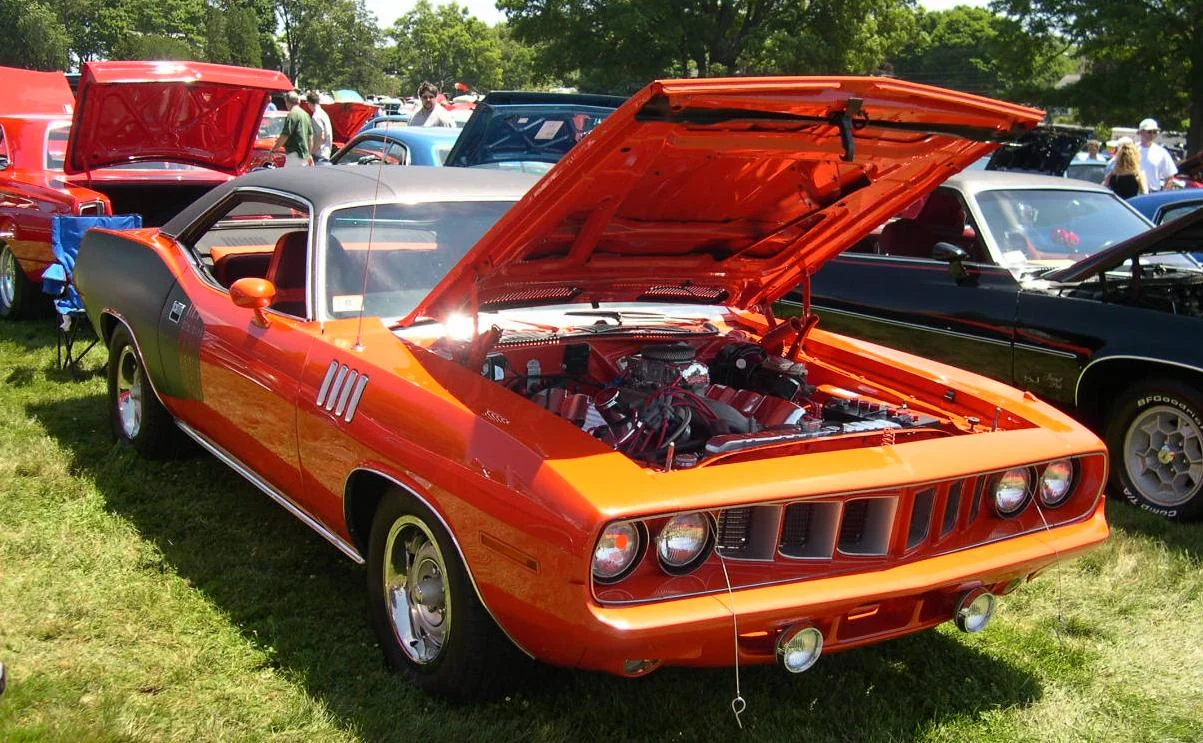 Sleek 1971 Plymouth Hemi 'Cuda, iconic muscle car, vibrant high-impact color.