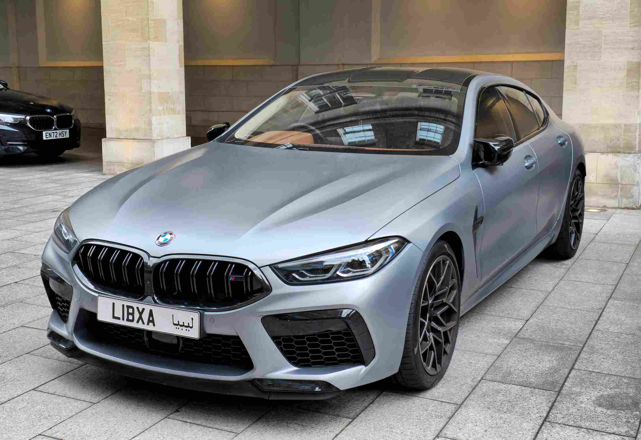 Sleek, powerful BMW M8 coupe, metallic grey paint, high performance.