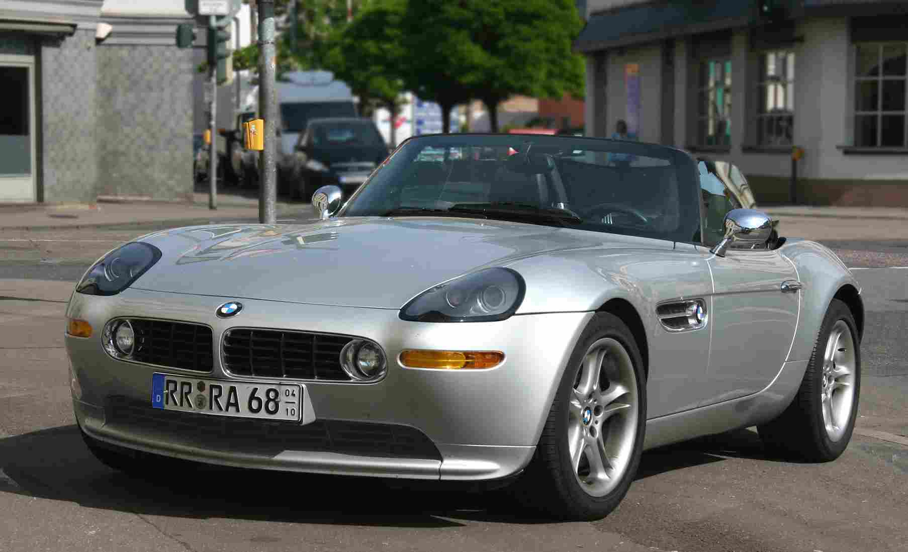Silver BMW Z8 roadster parked on a sunny coastal road