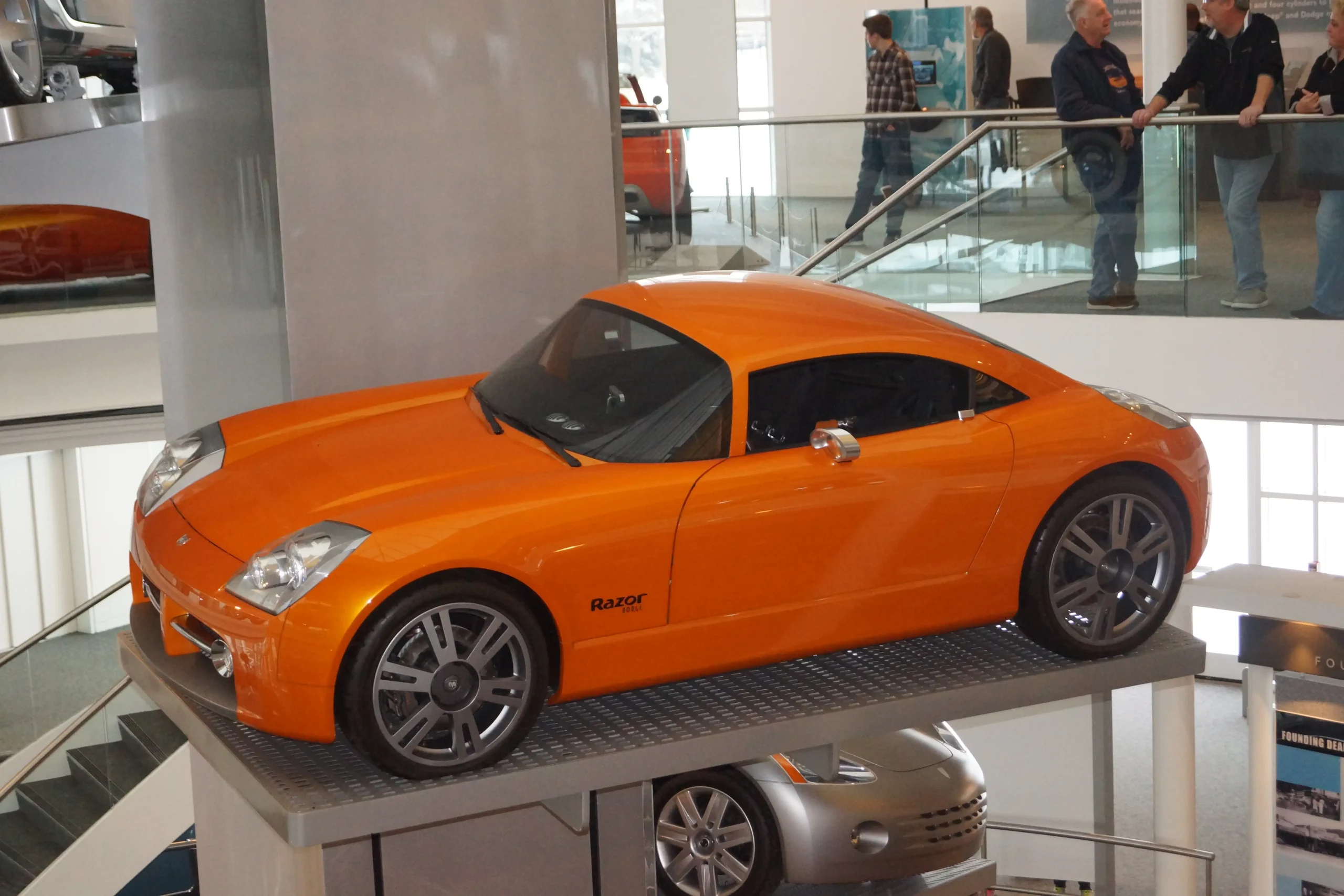 Sleek, silver Dodge Razor concept car with futuristic, angular design.