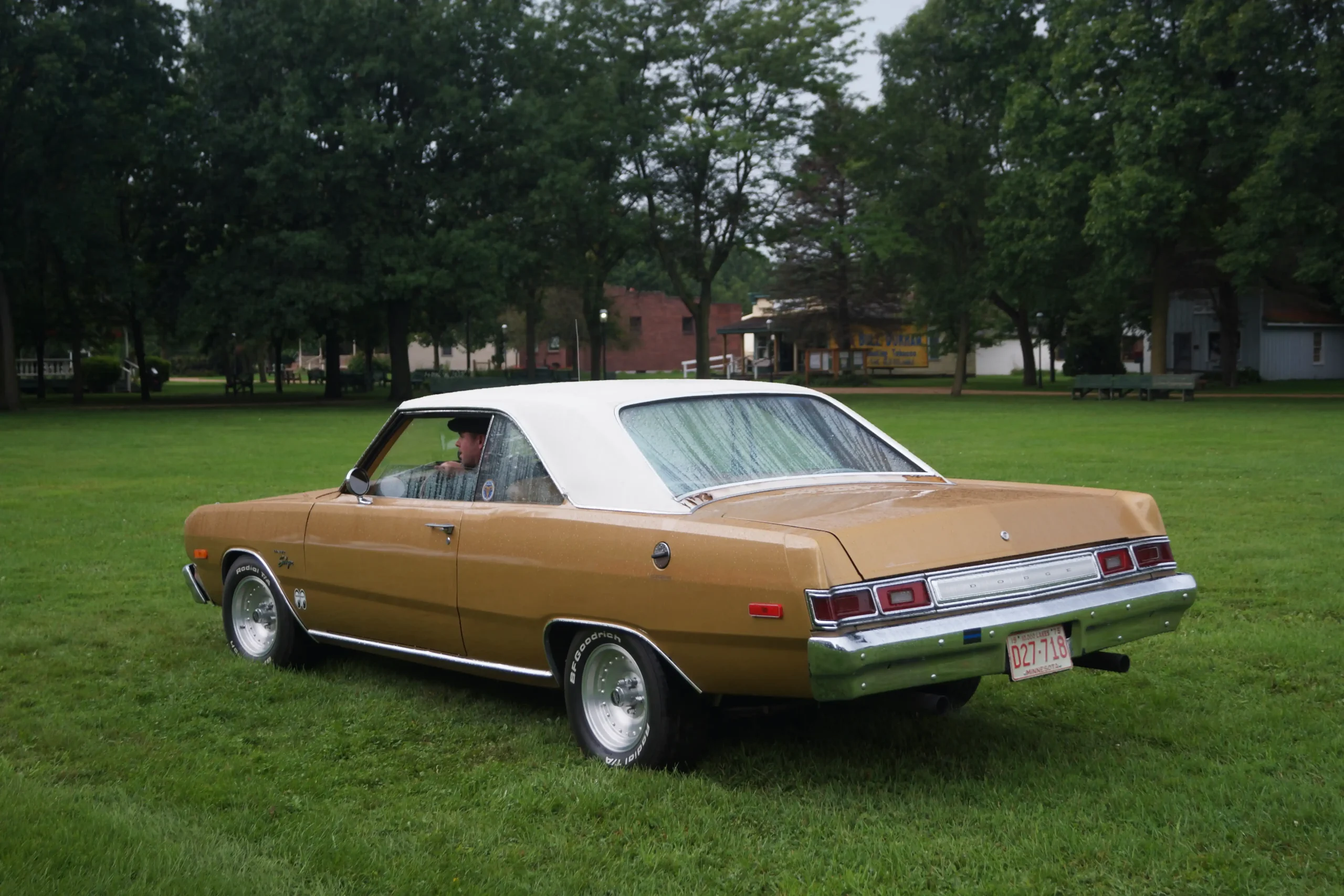 Classic 1970s Dodge Dart Swinger parked on a sunny street