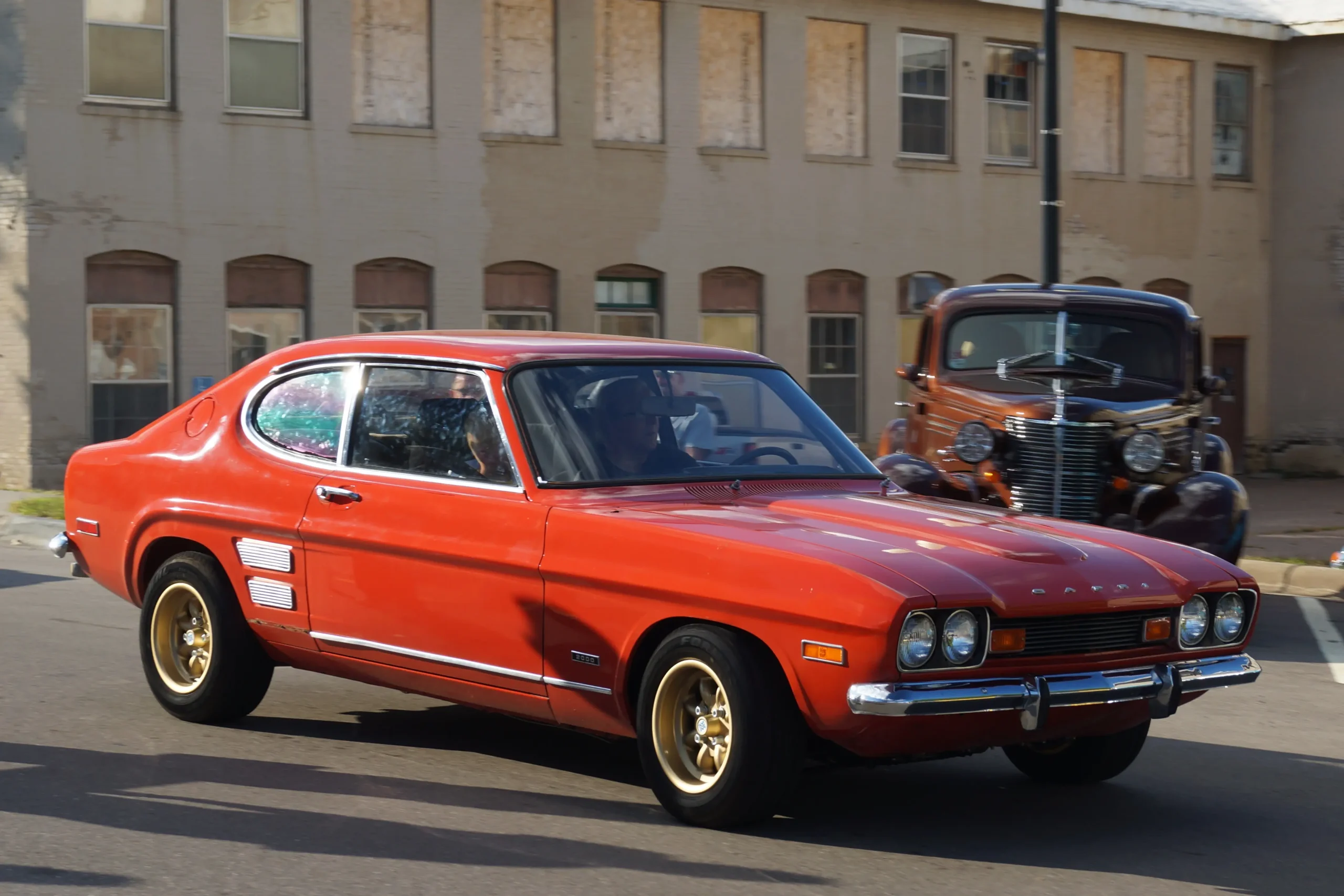 Classic Mercury Capri coupe, sleek lines, possibly parked on asphalt.