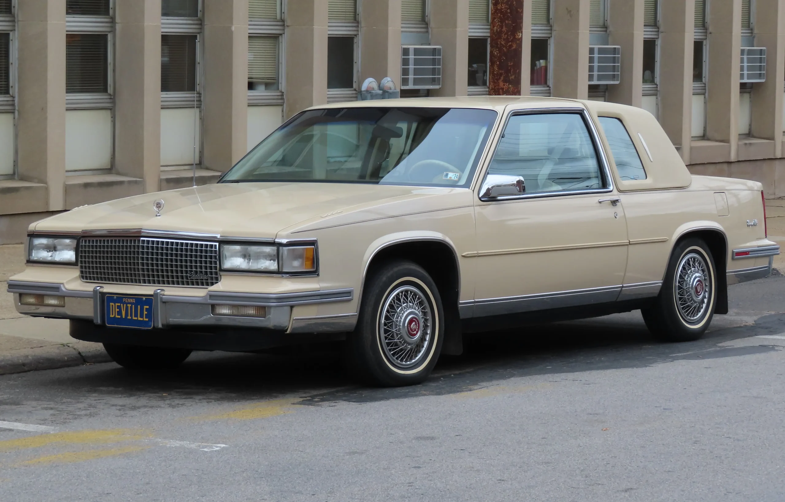 Classic 1988 Cadillac, chrome details gleaming, a symbol of luxury.