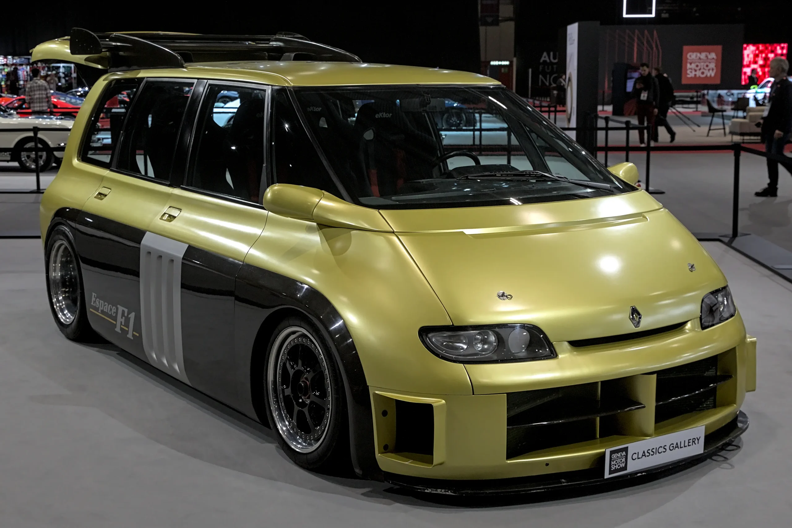 Red and yellow Renault Espace F1, a wild minivan racecar.