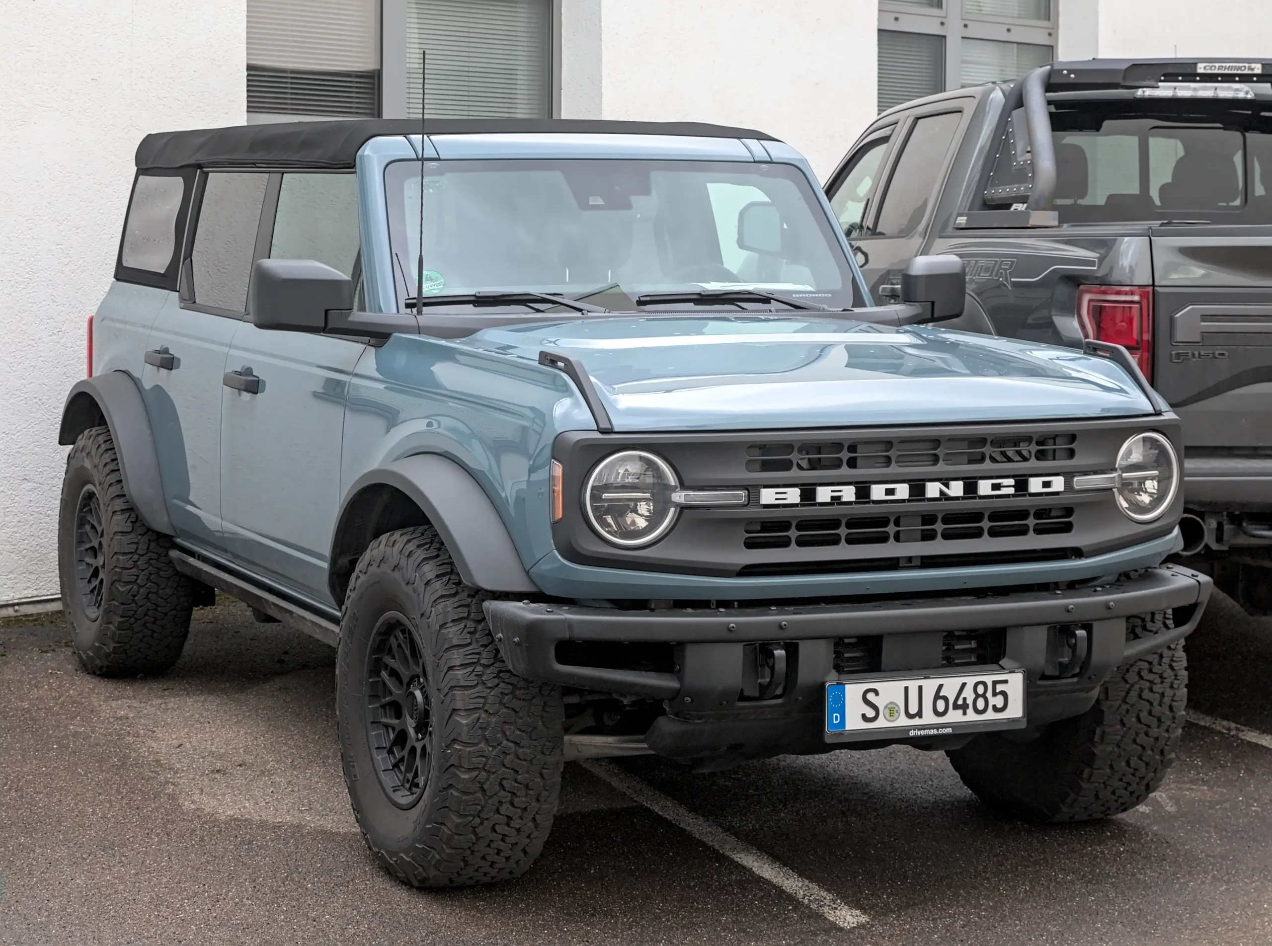 A Ford Bronco driving on a rocky, off-road trail.