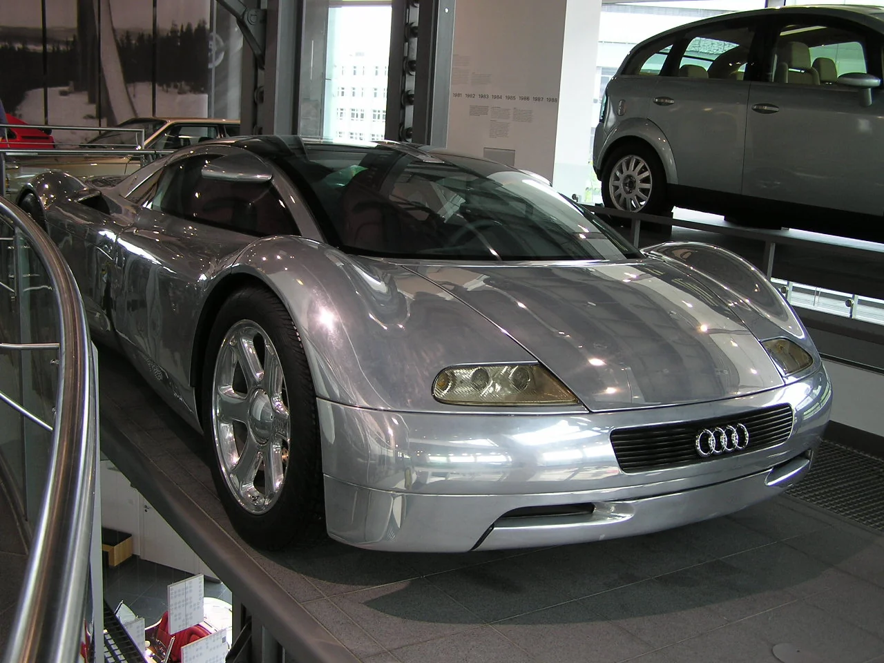 Sleek silver Audi Avus concept car with covered wheels.