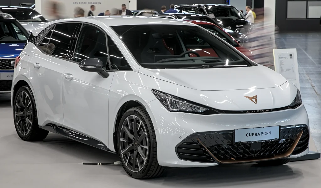Sleek electric Cupra Born in vibrant blue, sporty hatchback.