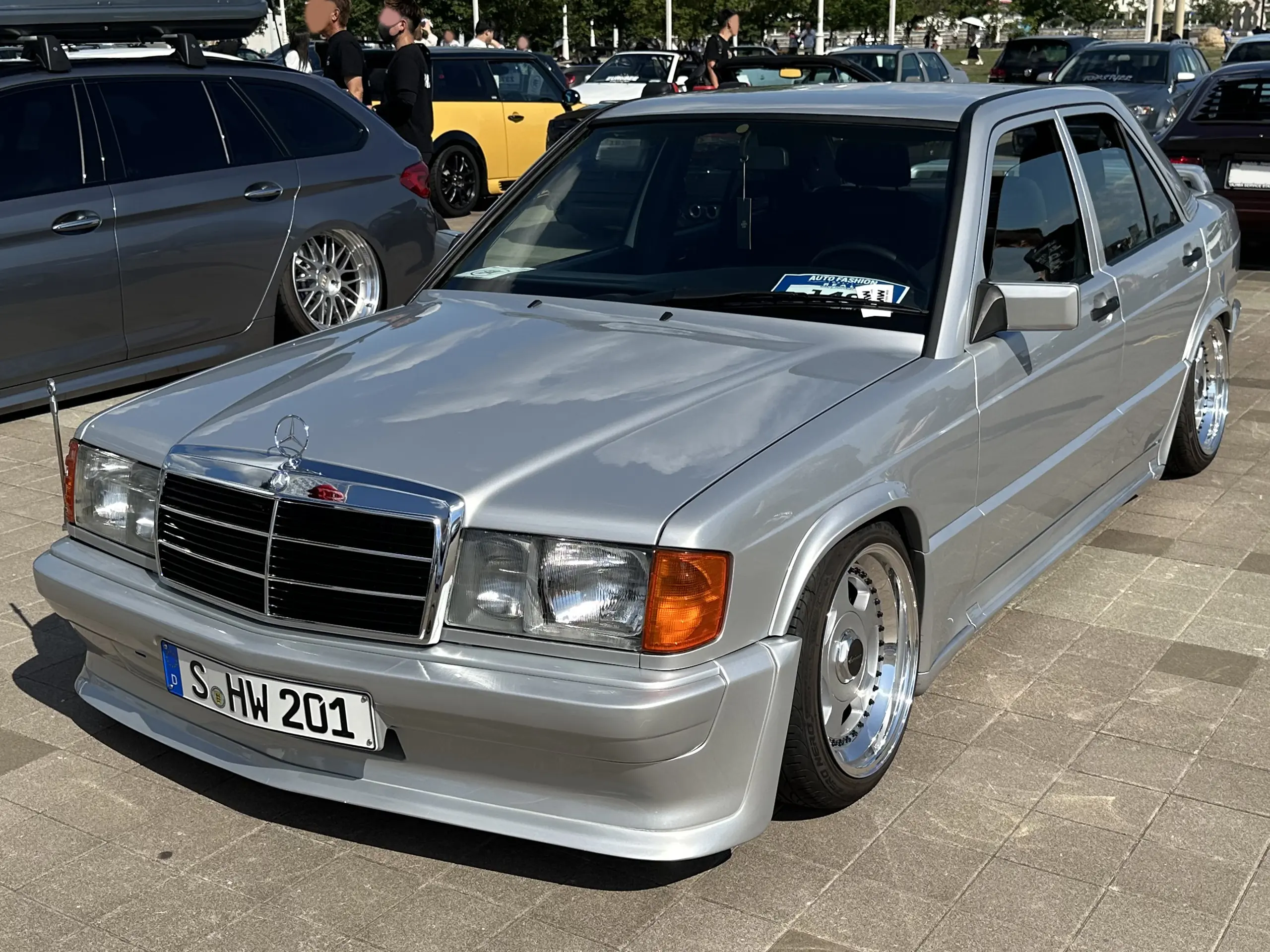 Aggressive, tuned Mercedes-Benz 190E 2.3-16 W201, classic front view.