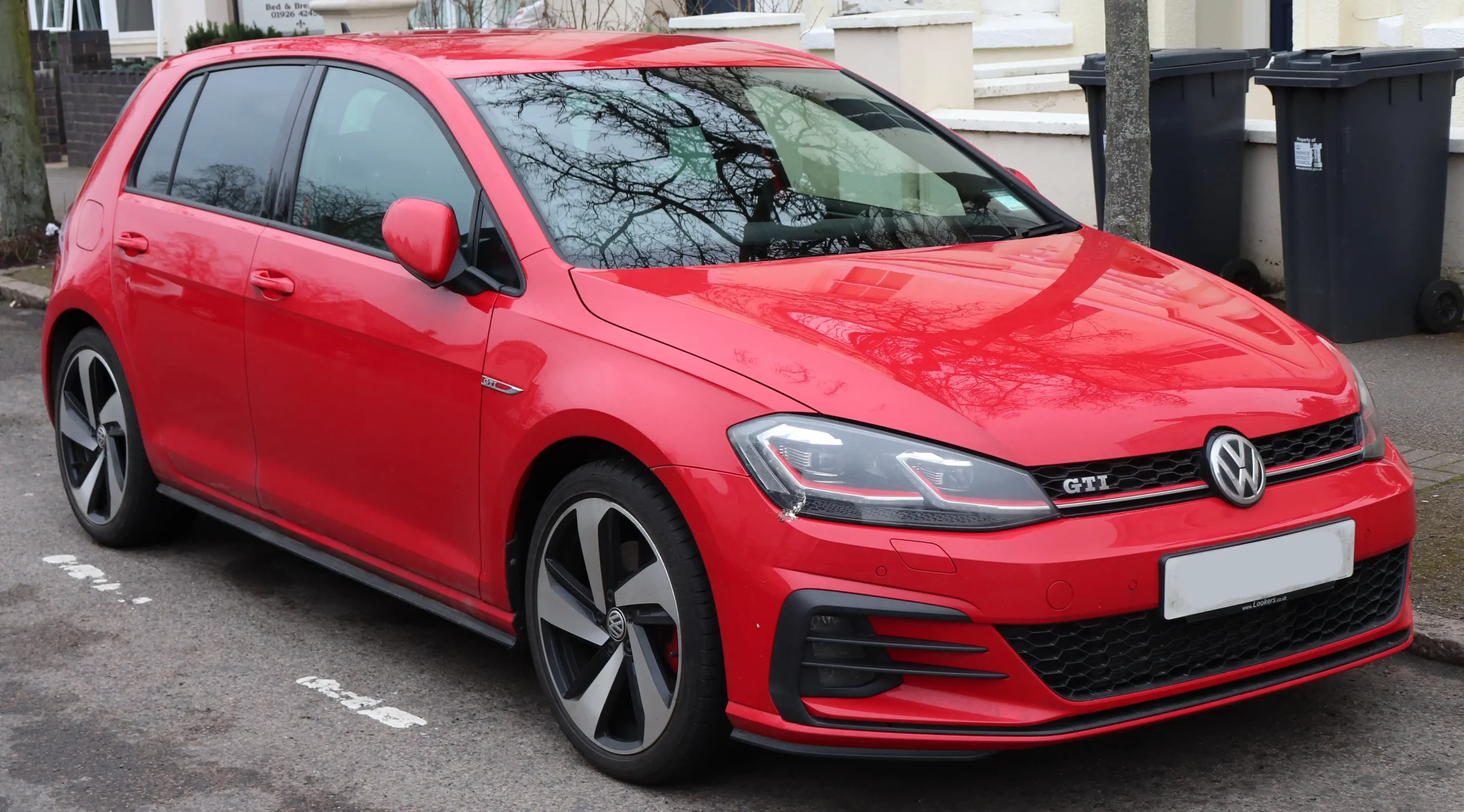 Front view of a red 2017 Volkswagen Golf GTi TSi 2.0 car.