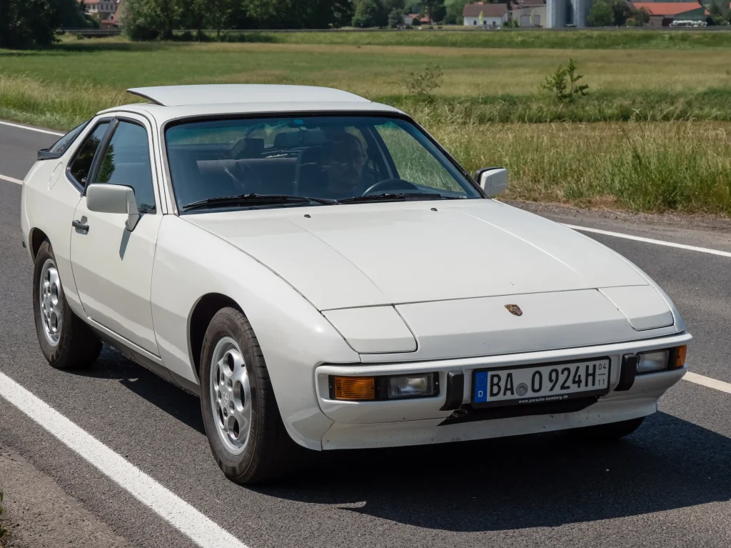 Sleek Porsche 924 coupe in silver, a classic sports car.

