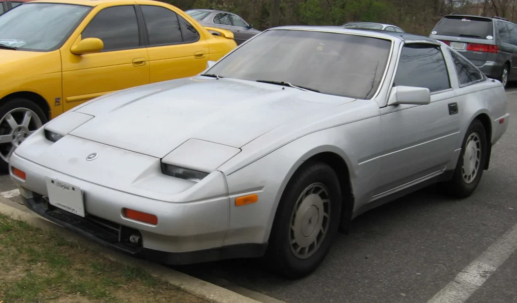 Sleek red Nissan 300ZX (Z31) sports car, 80s aesthetic.

