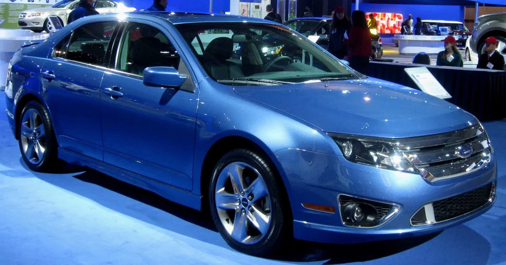 Ford Fusion Sport parked on a street, showcasing its sporty design.

