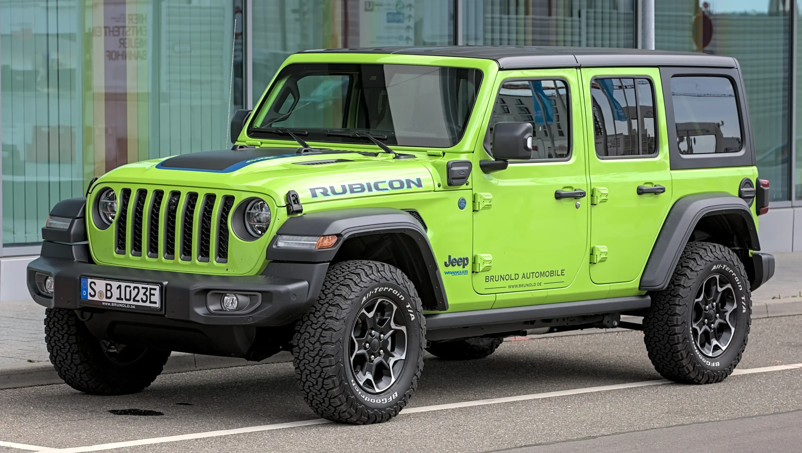 Jeep Wrangler driving on a rocky trail, off-road adventure. 
