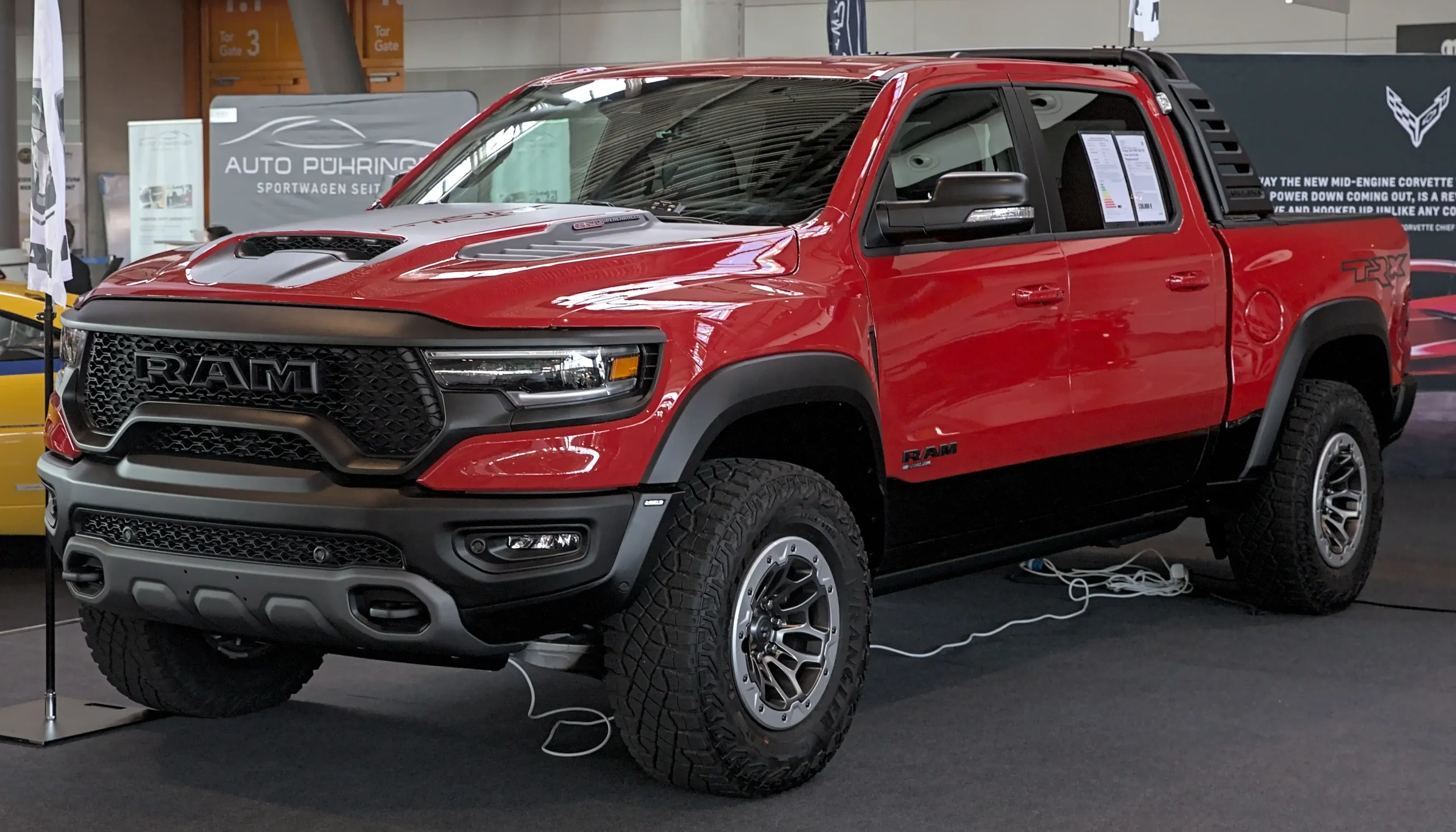 Aggressive Ram 1500 TRX truck dominating off-road terrain, powerful performance.