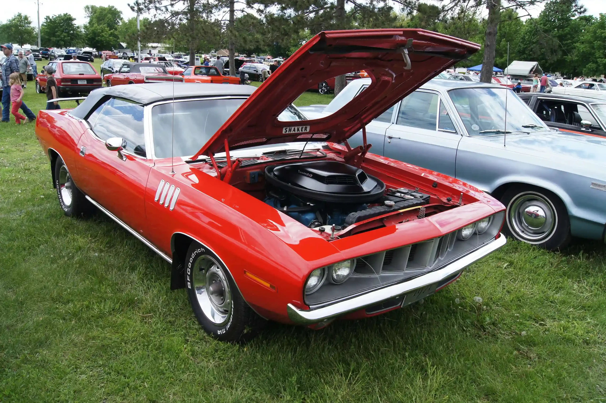 A vibrant orange 1971 Plymouth 'Cuda Convertible, classic