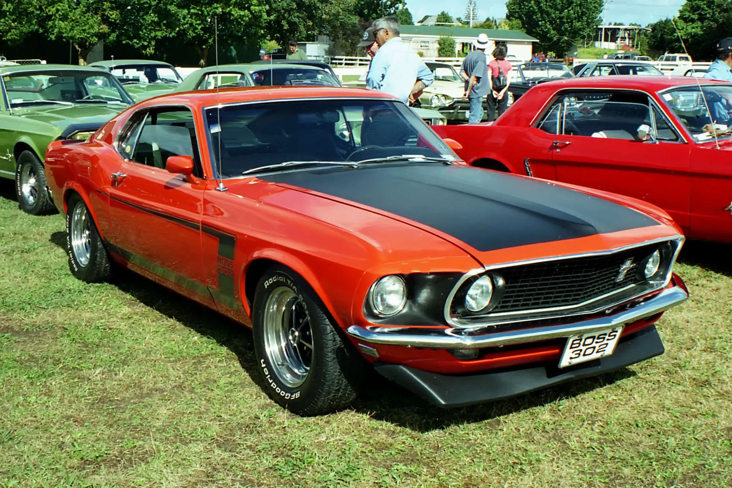 Profile of a vibrant orange 1969 Ford Mustang Boss 3