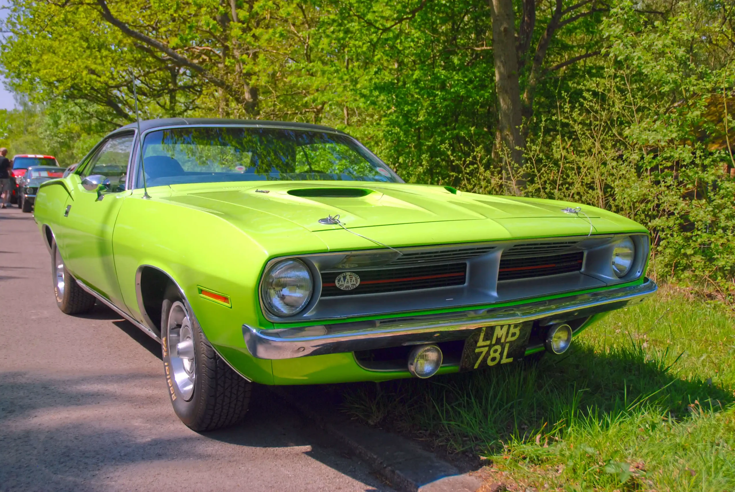 Classic 1970 Plymouth Barracuda muscle car, vibrant color,