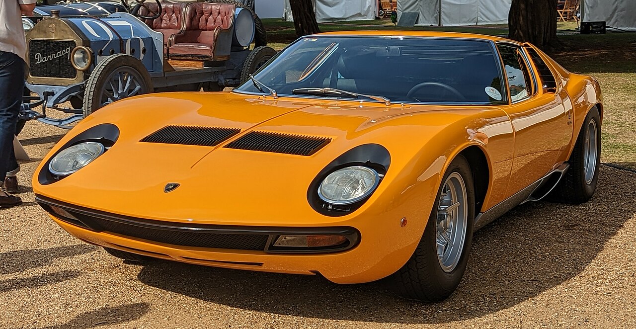 Lamborghini Miura classic supercar with distinctive low profile and round headlights at outdoor car show