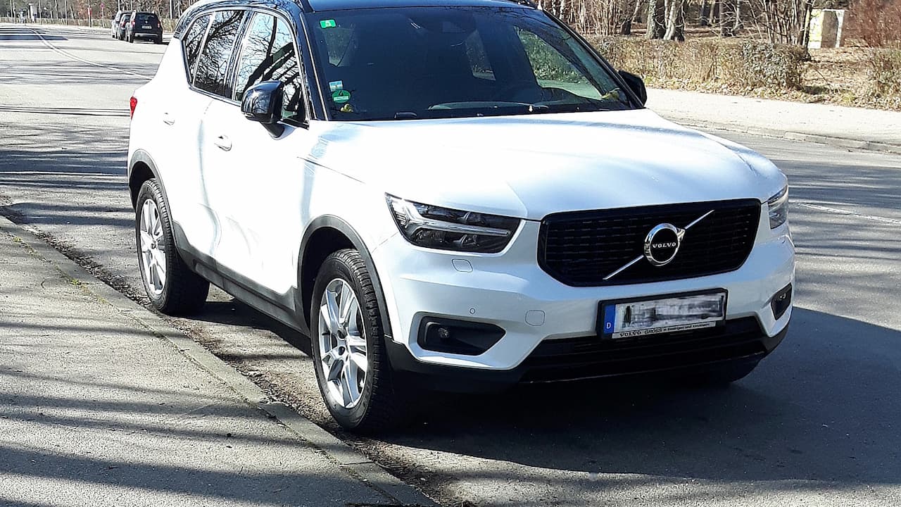 White 2025 Volvo XC40 parked on road with distinctive black grille and Thor's hammer LED headlights