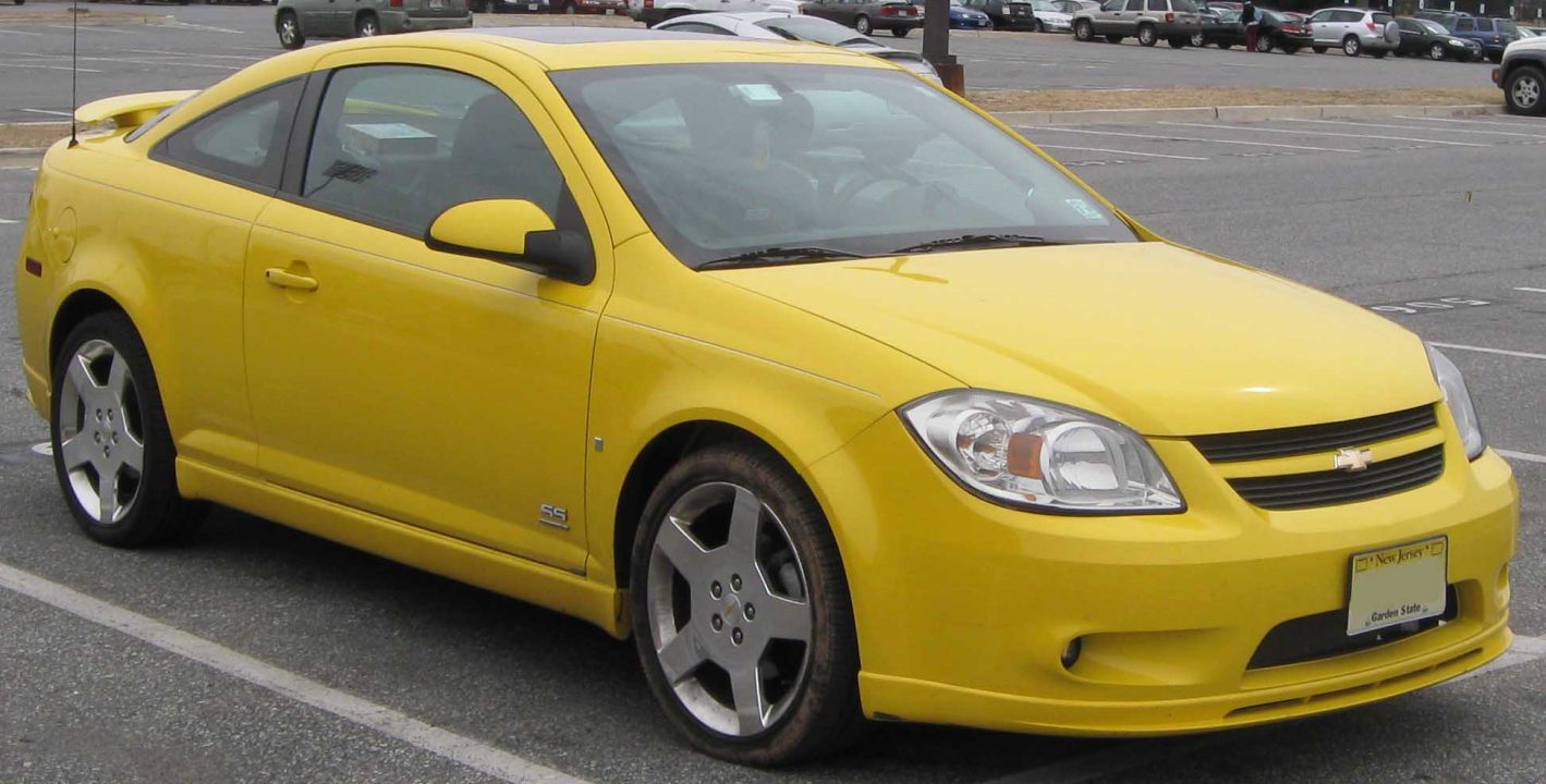 Bright yellow Chevrolet Cobalt SS parked in lot with sporty wheels and Chevrolet bowtie grille emblem