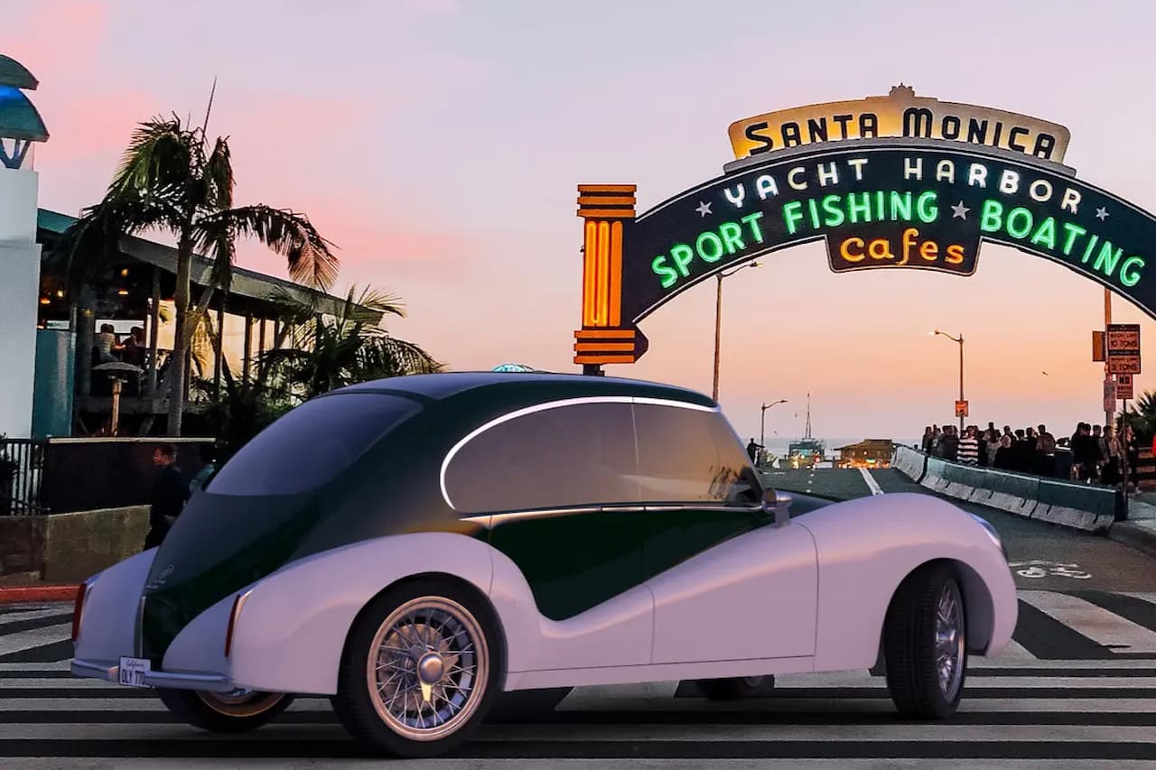 Purple and black Olympian Motors Model O1 retro-styled electric car parked at Santa Monica Pier during sunset