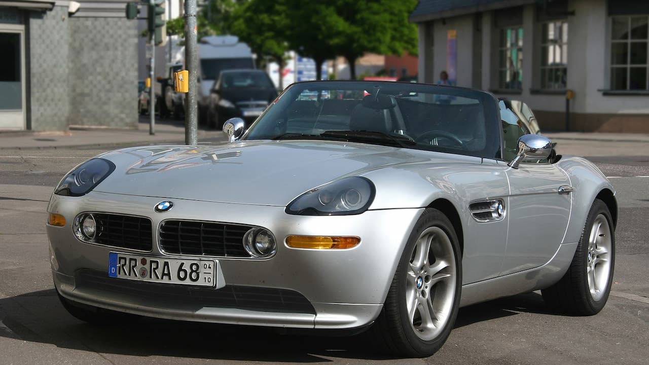Silver BMW Z8 parked on European street with German license plate, classic sports car design