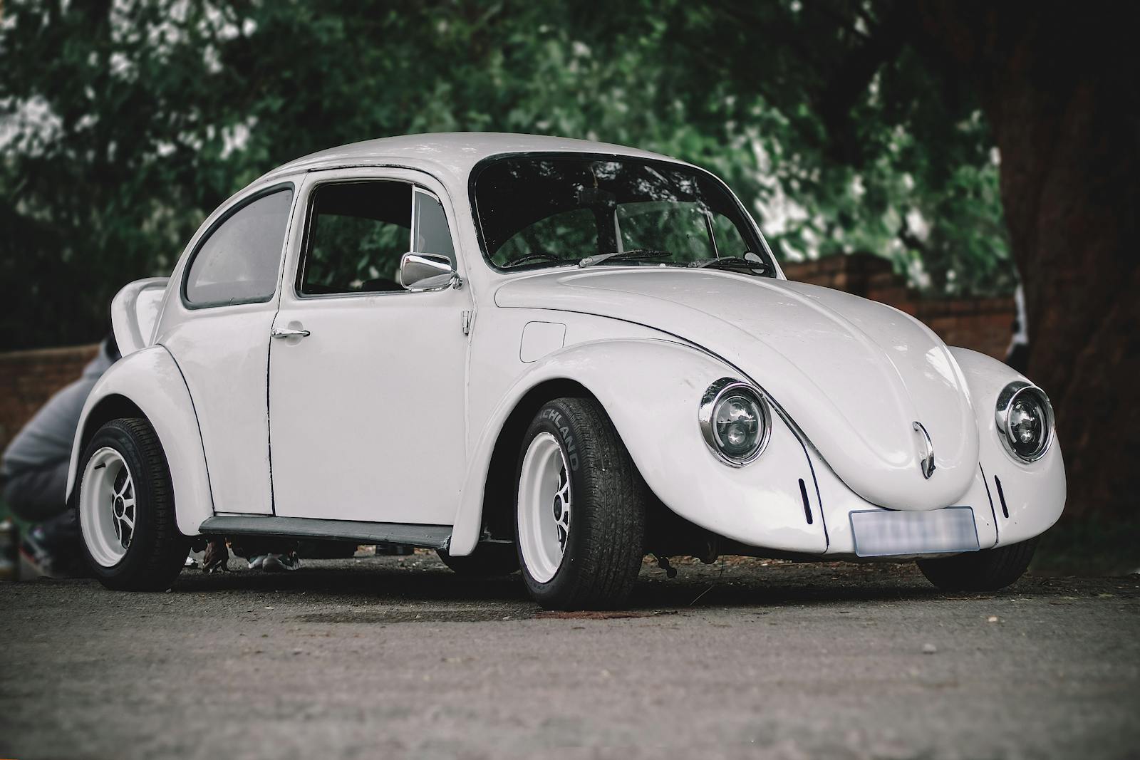 Classic white Volkswagen Beetle parked outdoors in Johannesburg, South Africa.