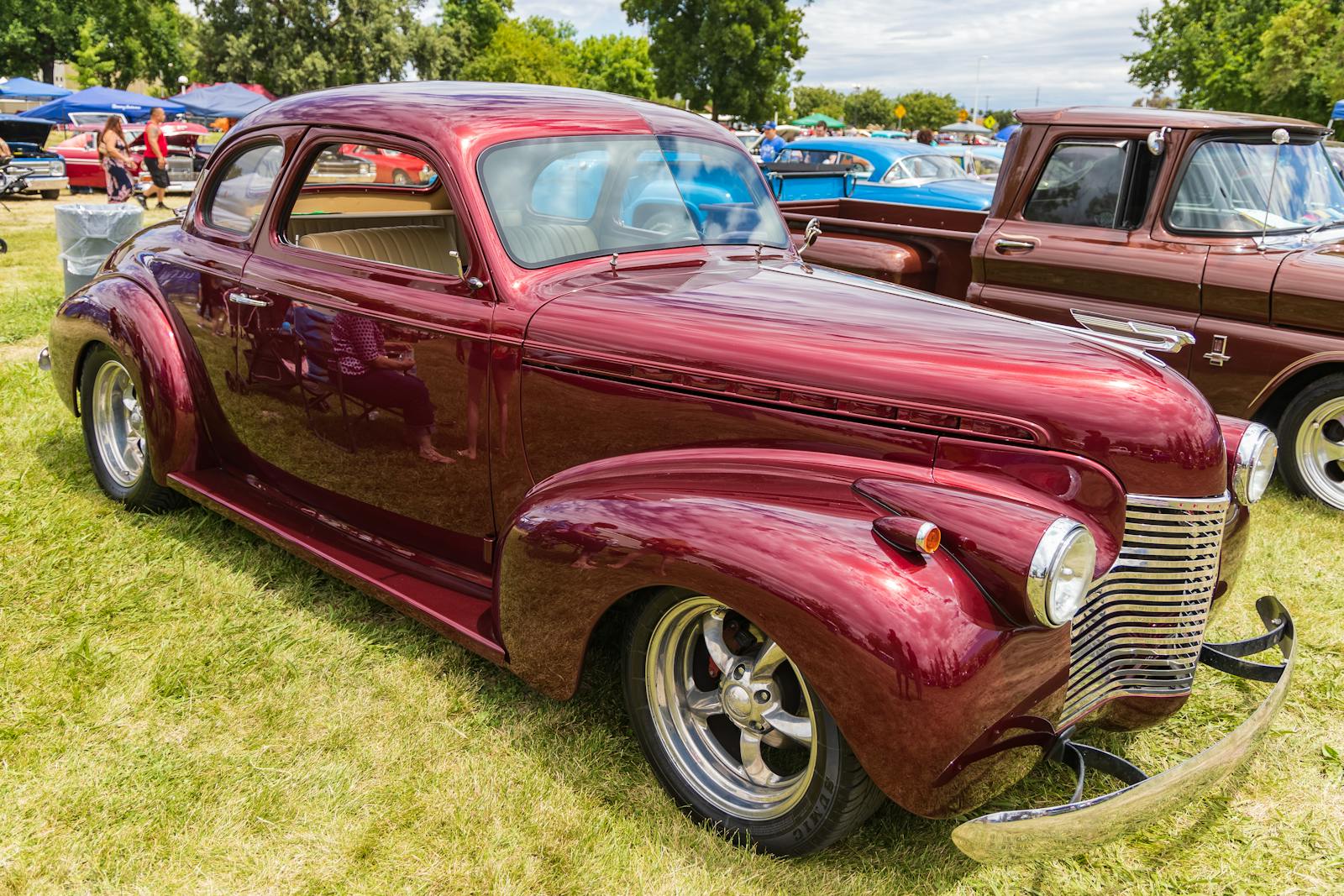 A beautifully restored vintage Chevrolet shines at a classic car show in Modesto, California.