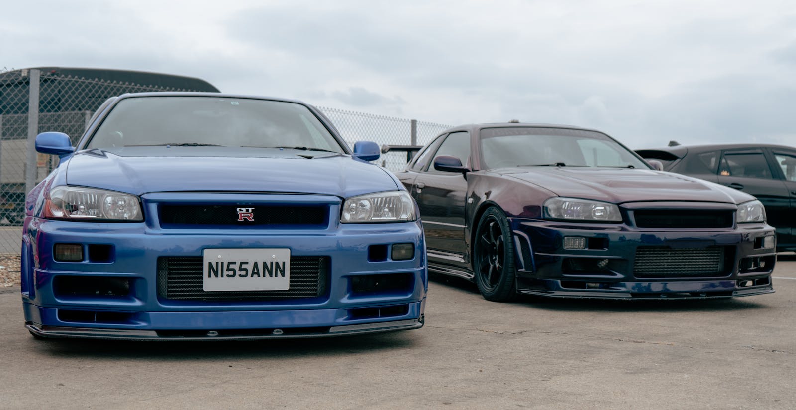 Two Nissan GTR R34 cars showcased at Japfest 2025 in England.