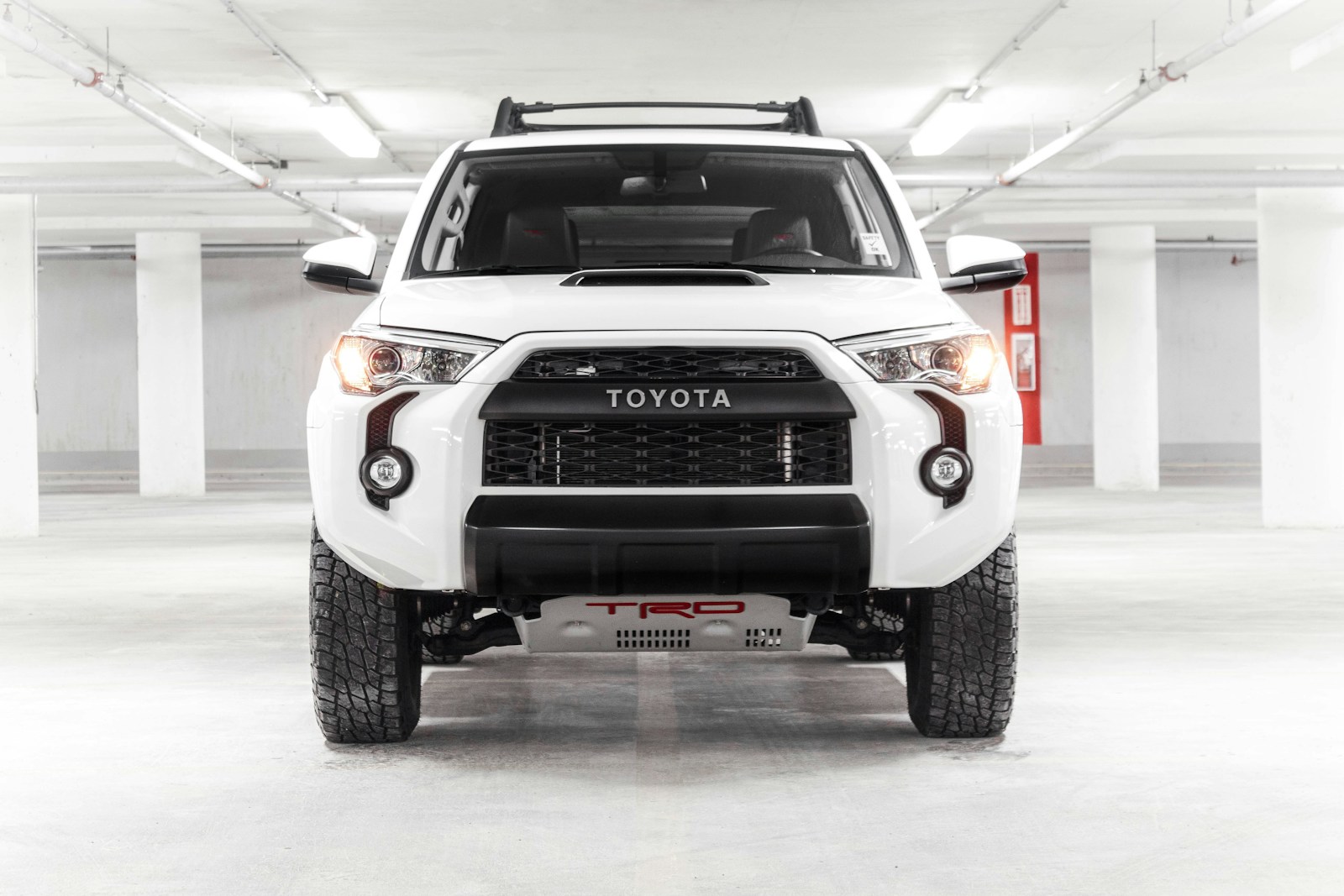 a white truck parked in a parking garage
