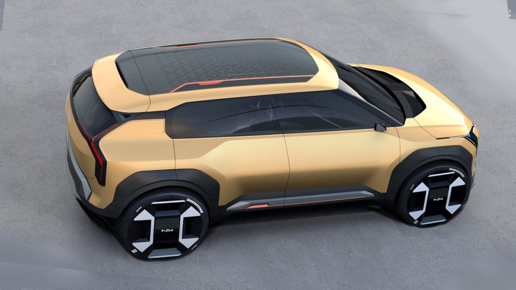 Futuristic gold concept car design showcasing modern electric vehicle features.