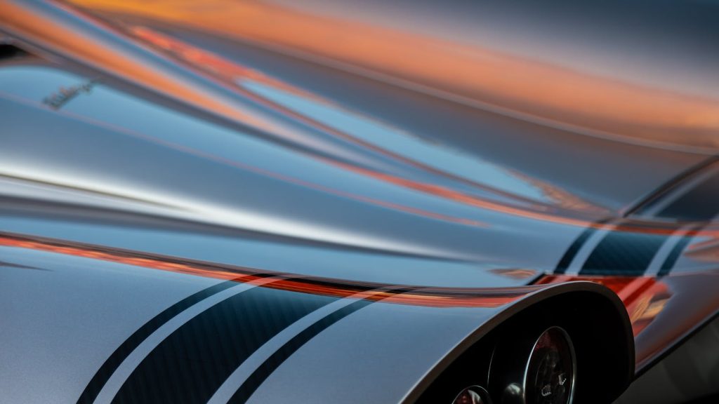 Sleek car surface details with elegant reflections and smooth lines, capturing luxury automotive design.
