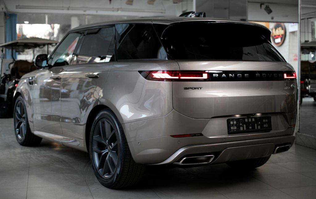 Elegant Range Rover SUV showcased in a stylish automobile showroom in Egypt.