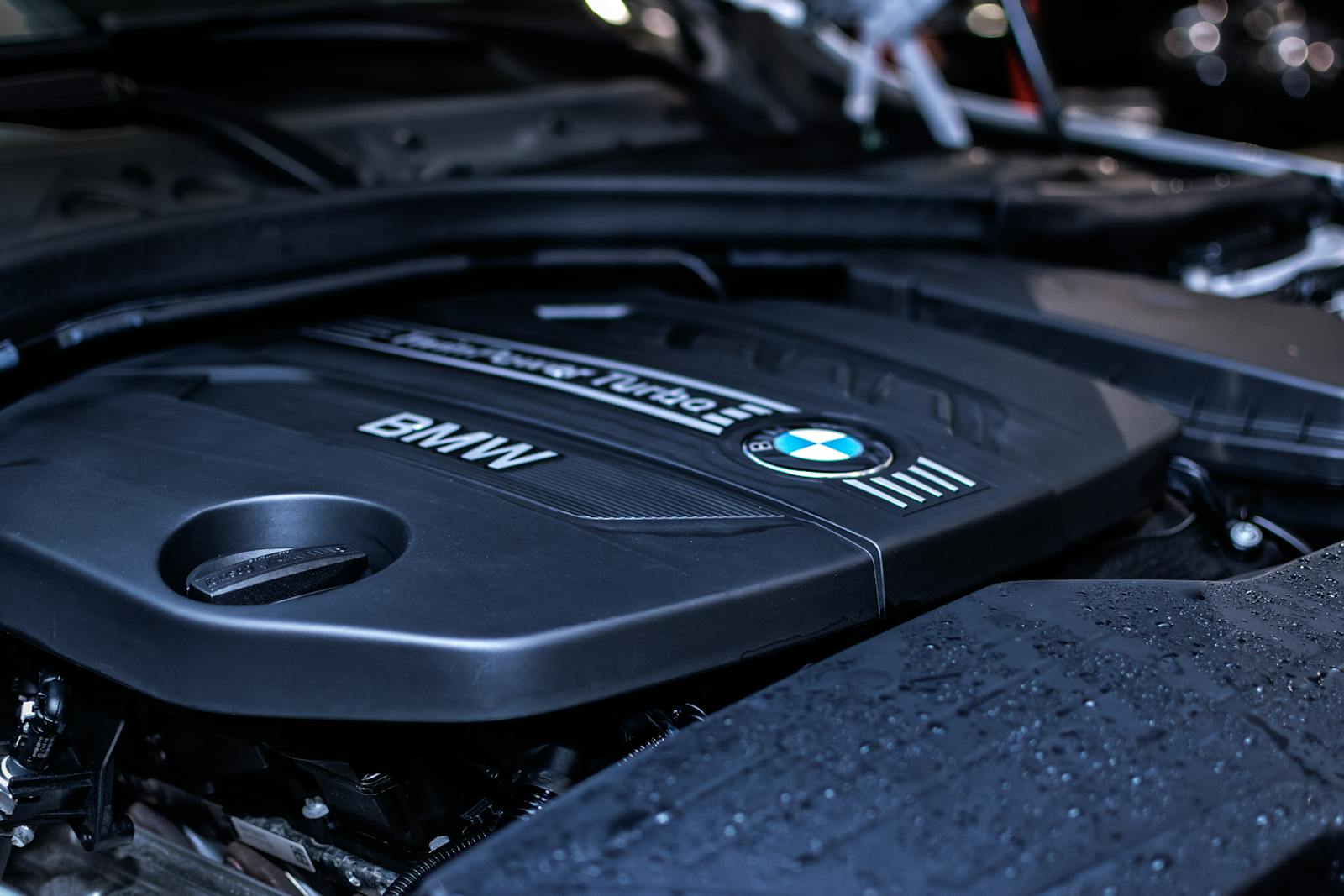 Detailed view of a BMW engine highlighting the turbocharger and modern components.