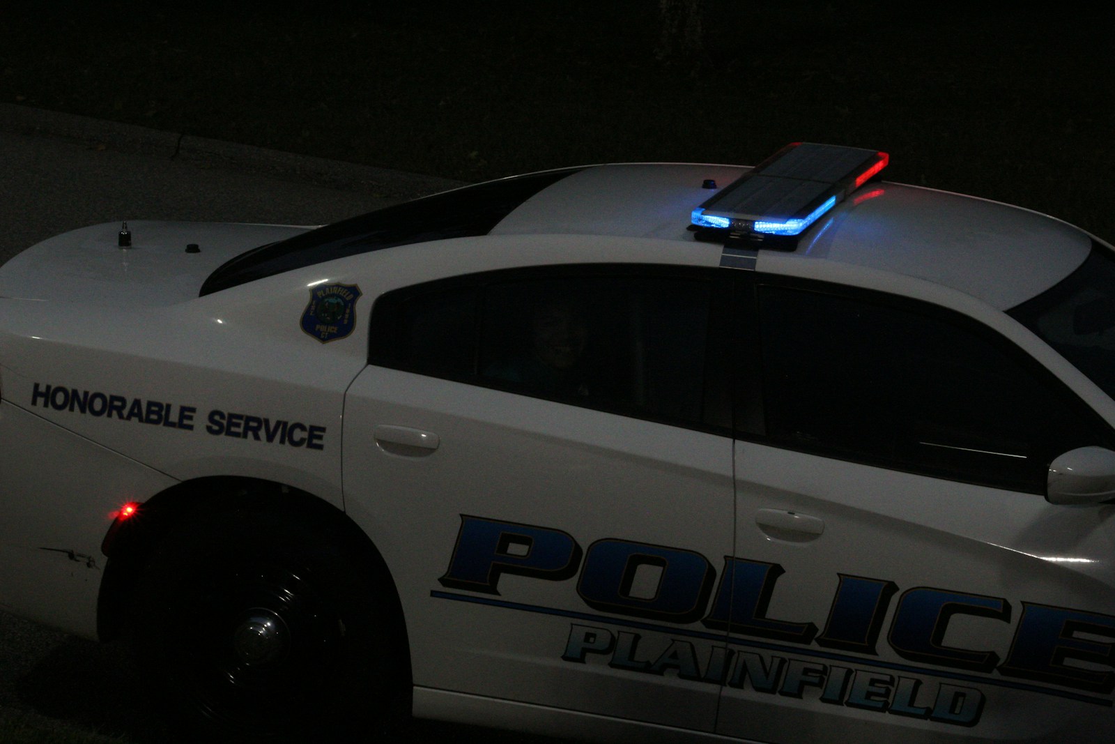 a police car parked on the side of the road