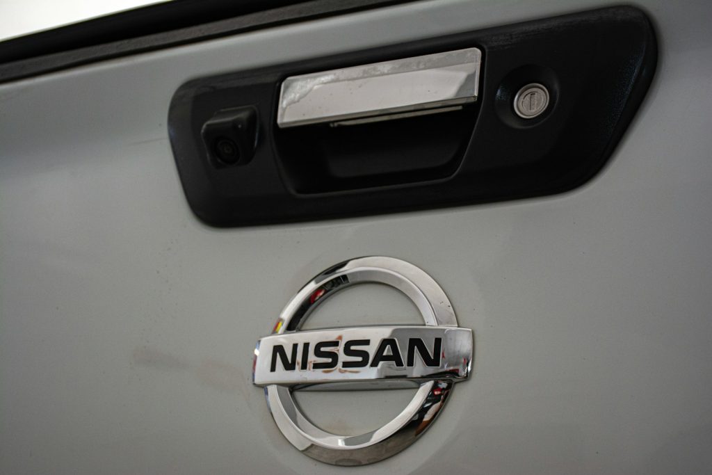 a close up of a nissan emblem on a car