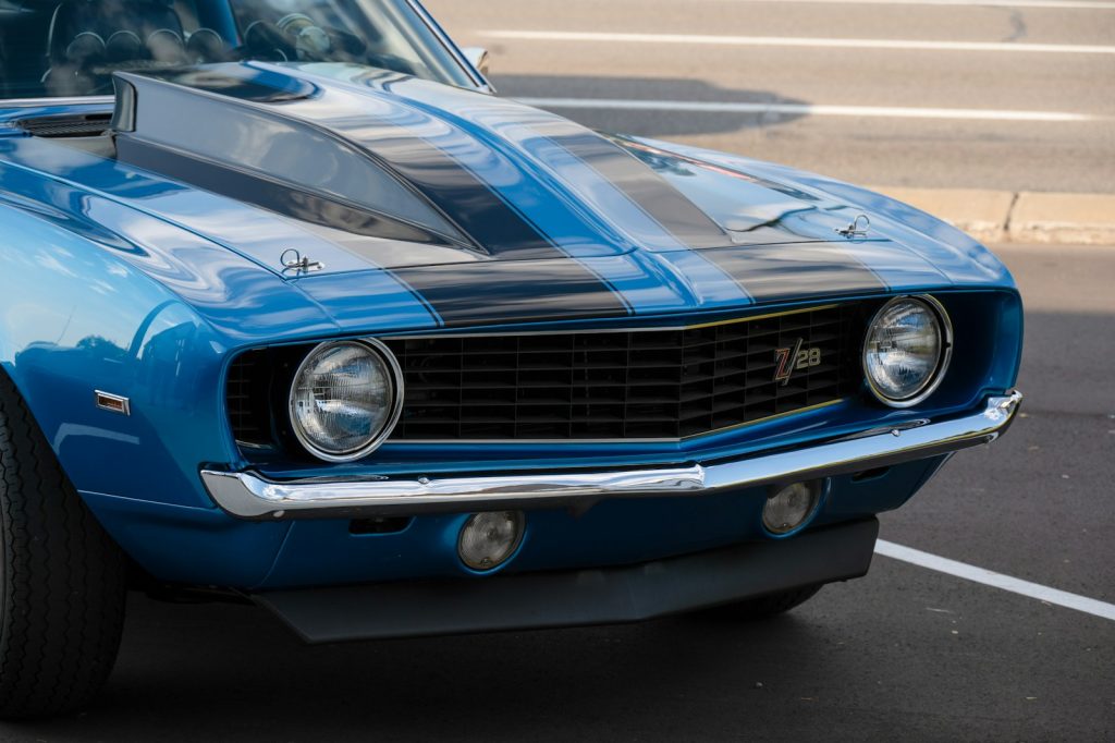 Blue classic car with black racing stripes